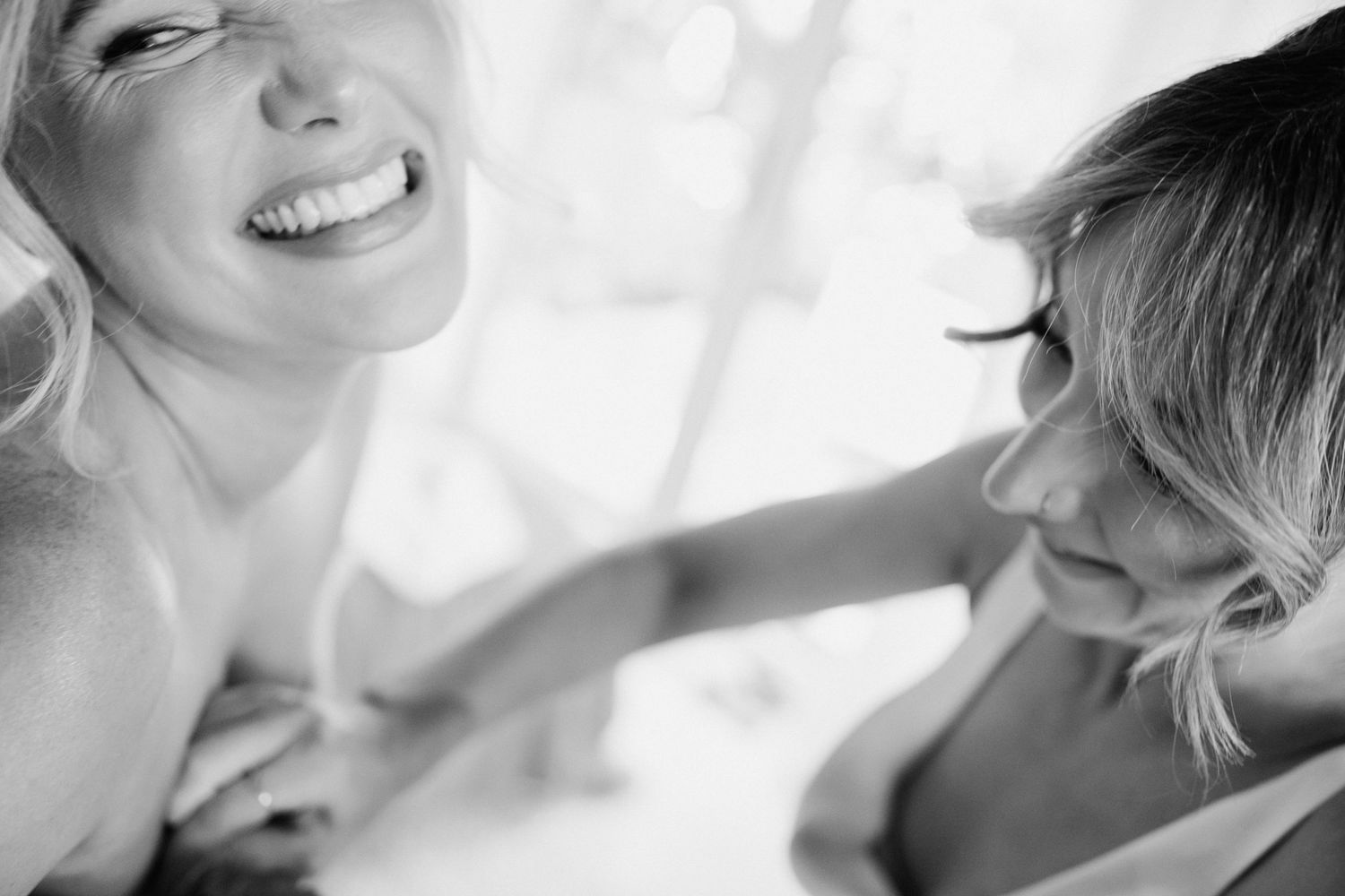 A candid moment from the bride getting dressed at a country wedding in Australia