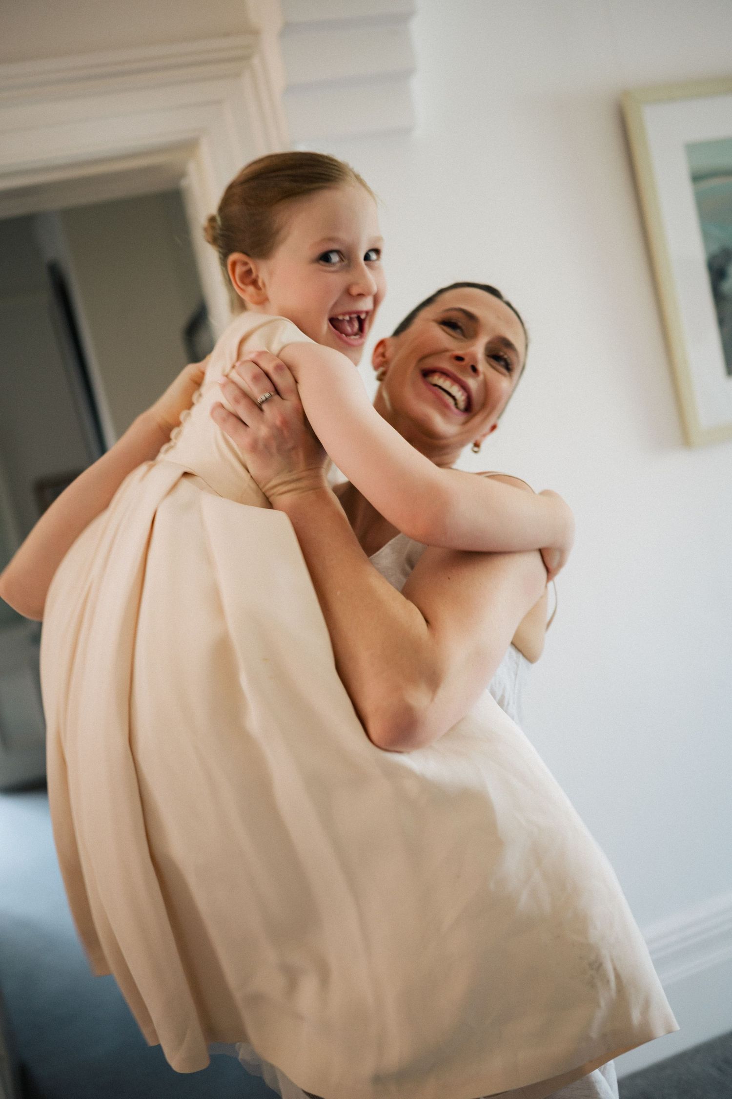 Joyful moment between parent and child at a luxury wedding in Australia