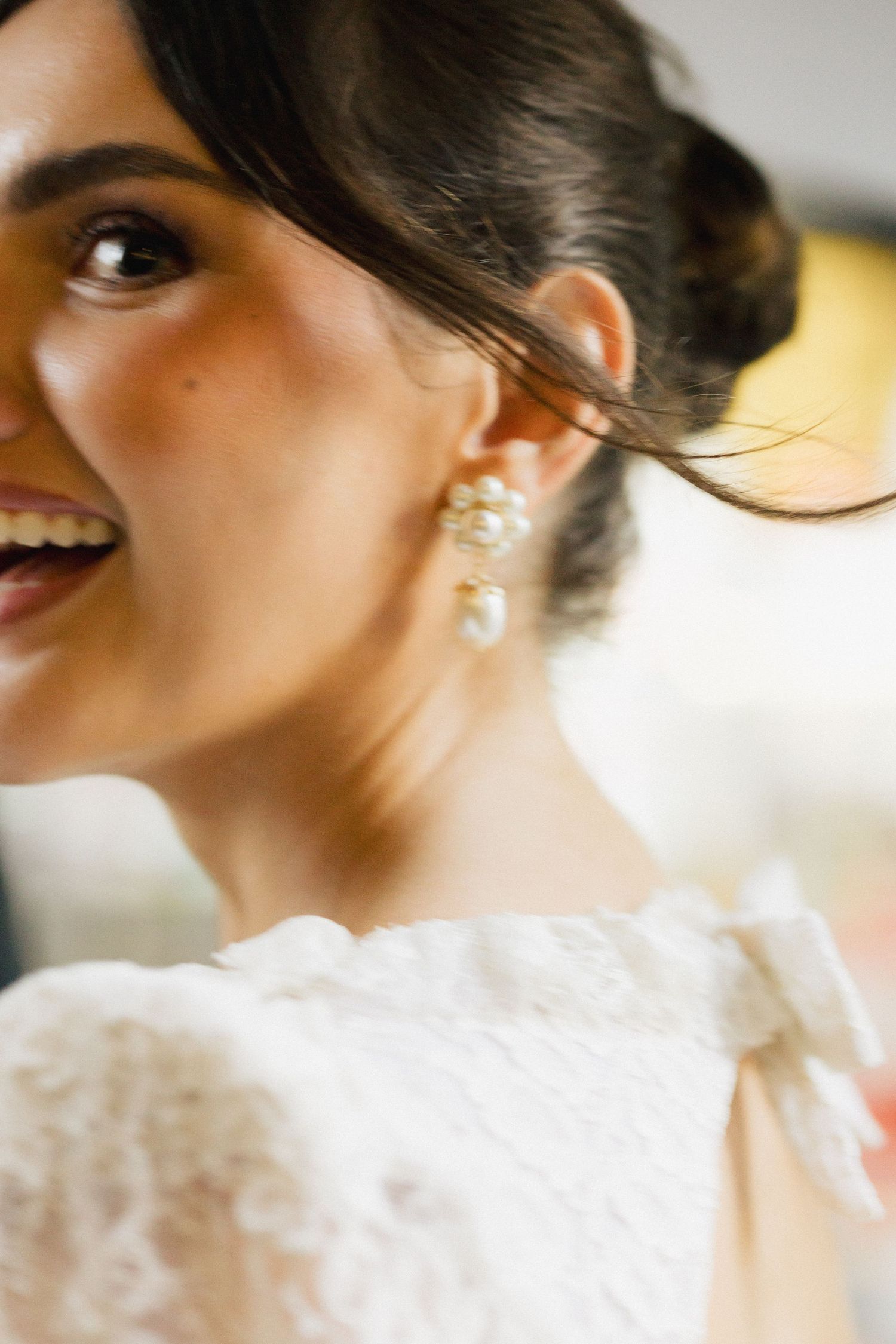 Close-up profile shots showing delicate lace details and jewelry in warm lighting.