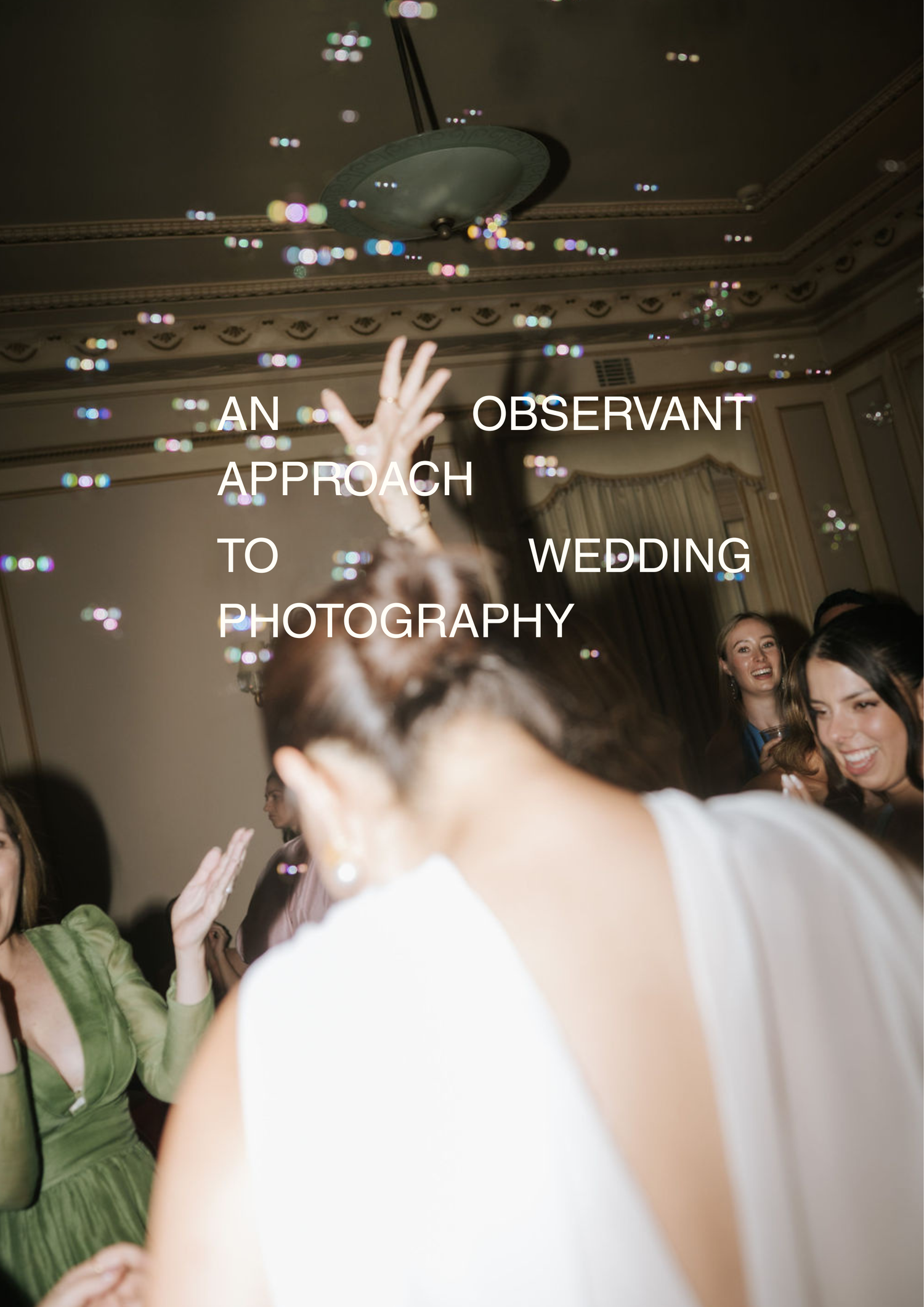 Bride dancing with guests at a wedding reception, bubbles floating in the air, captured in an observant photography style.