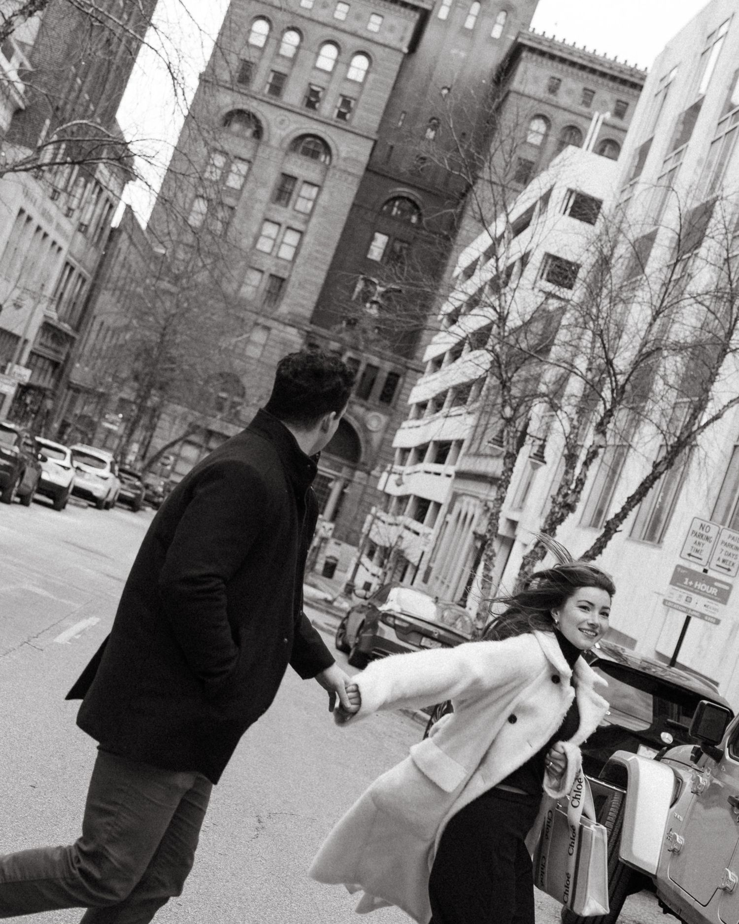 Black and white urban street scenes showing silhouettes against city buildings and architecture.