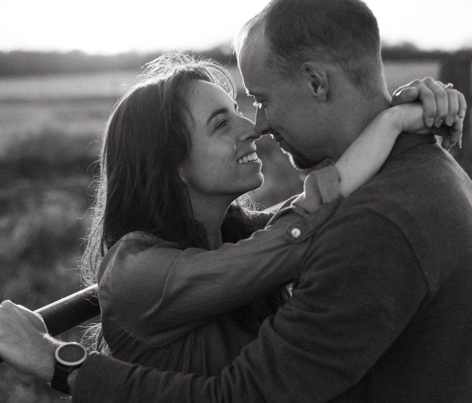 Black and white series of romantic couple moments at sunset.