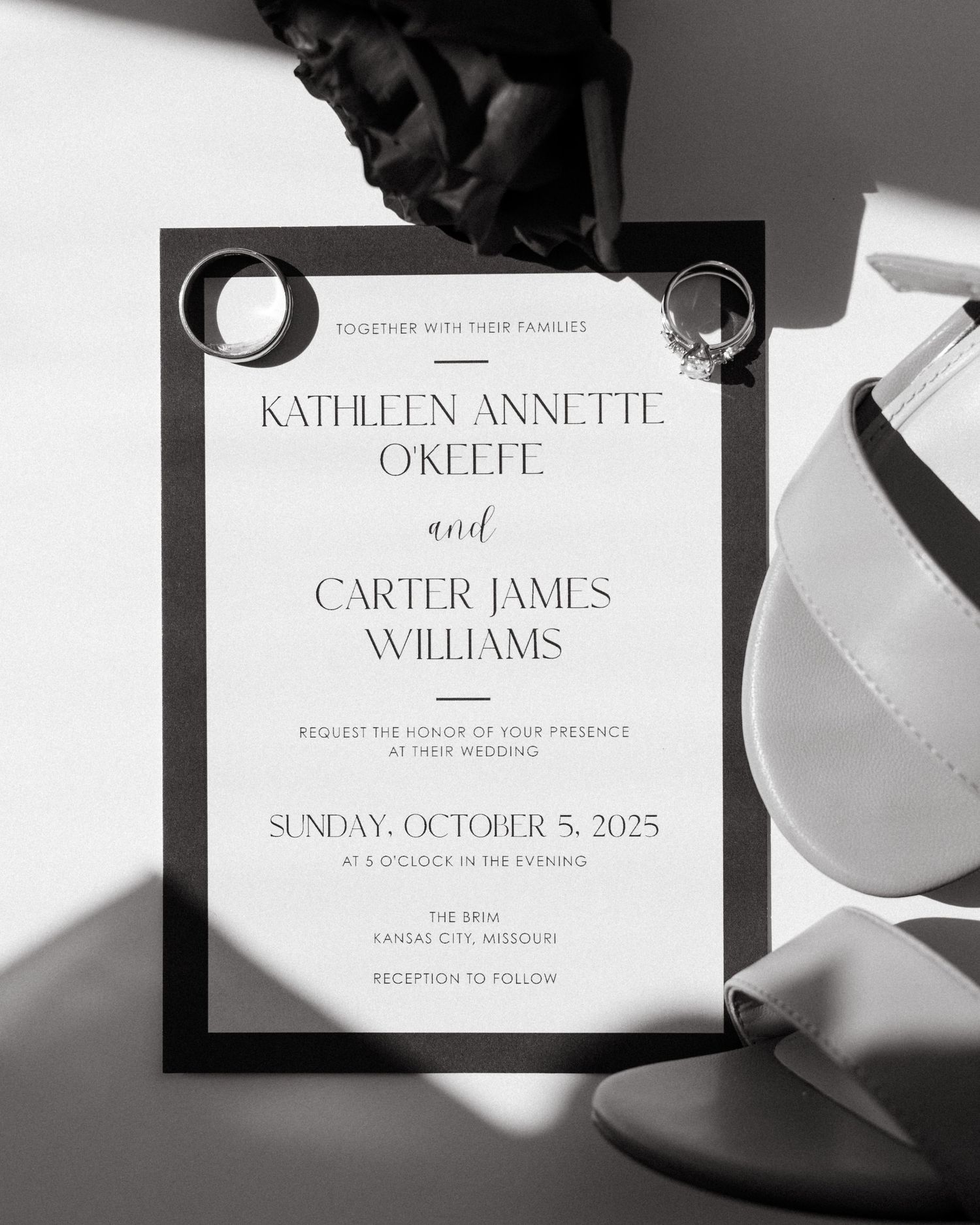Black and white wedding invitations with modern typography and elegant design.