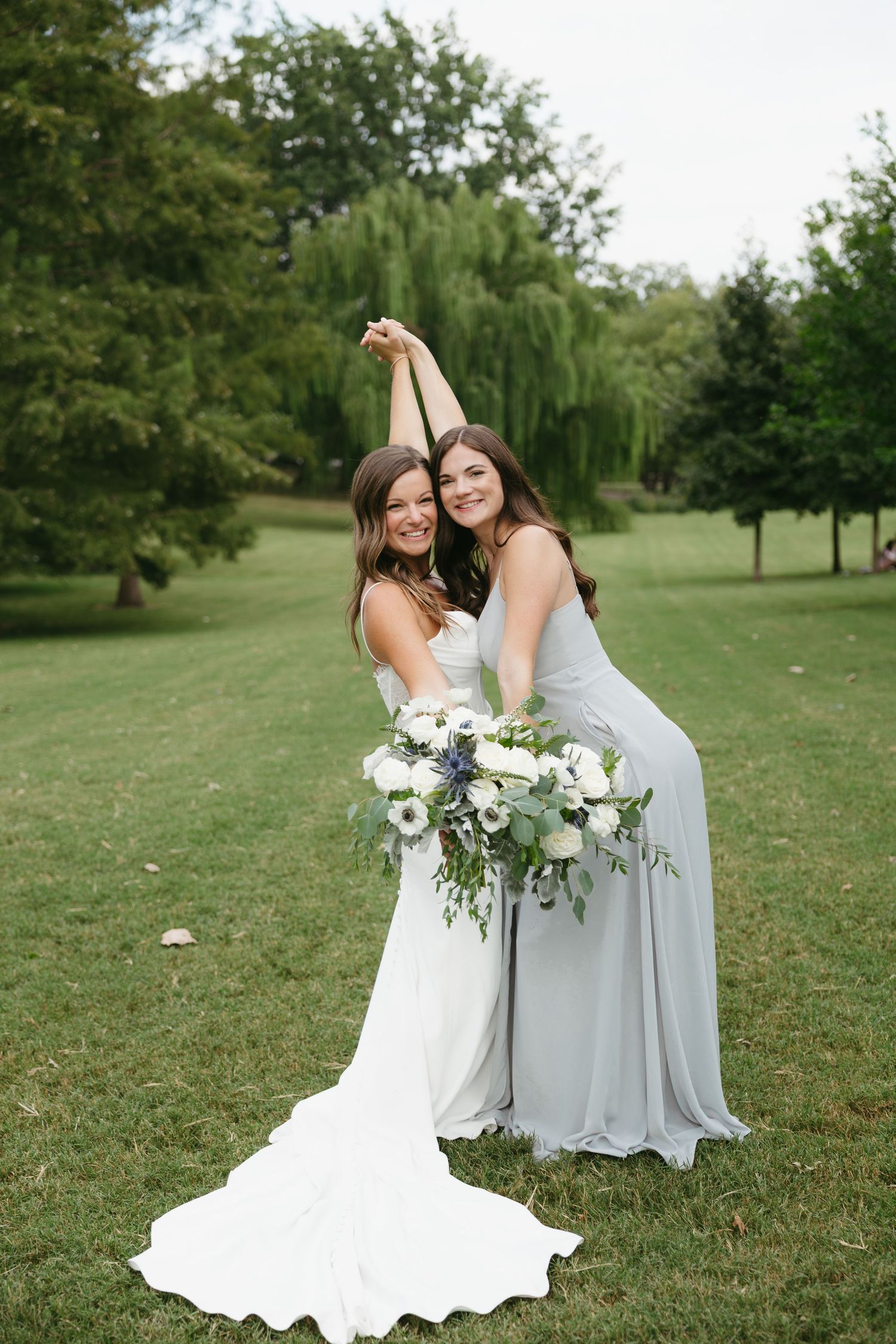 A series of joyful wedding photos showing bridesmaids in white and light blue dresses dancing in a garden setting.