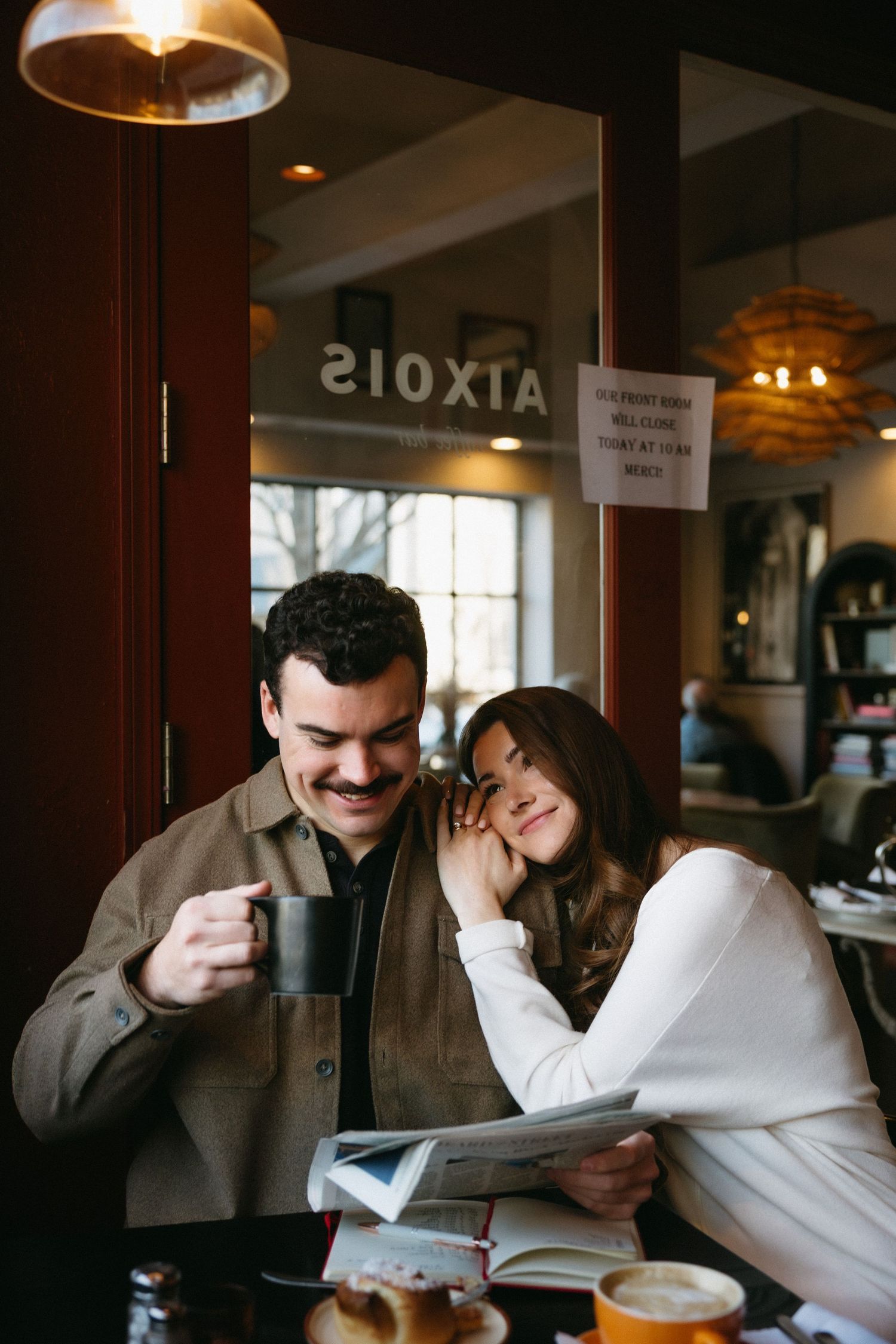 A candid sequence of laughter and joy shared over coffee at a cozy cafe interior.