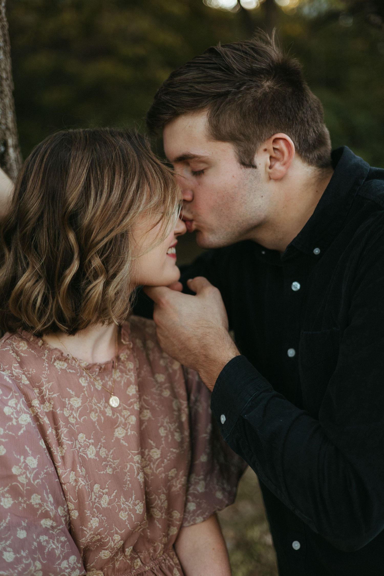 A romantic series of close-up shots showing tender moments between a couple at dusk.