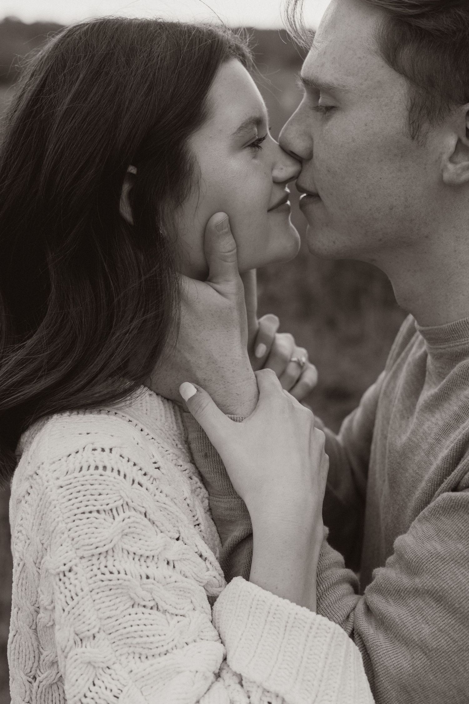 A romantic black and white photo sequence shows a couple sharing tender kisses and intimate moments.