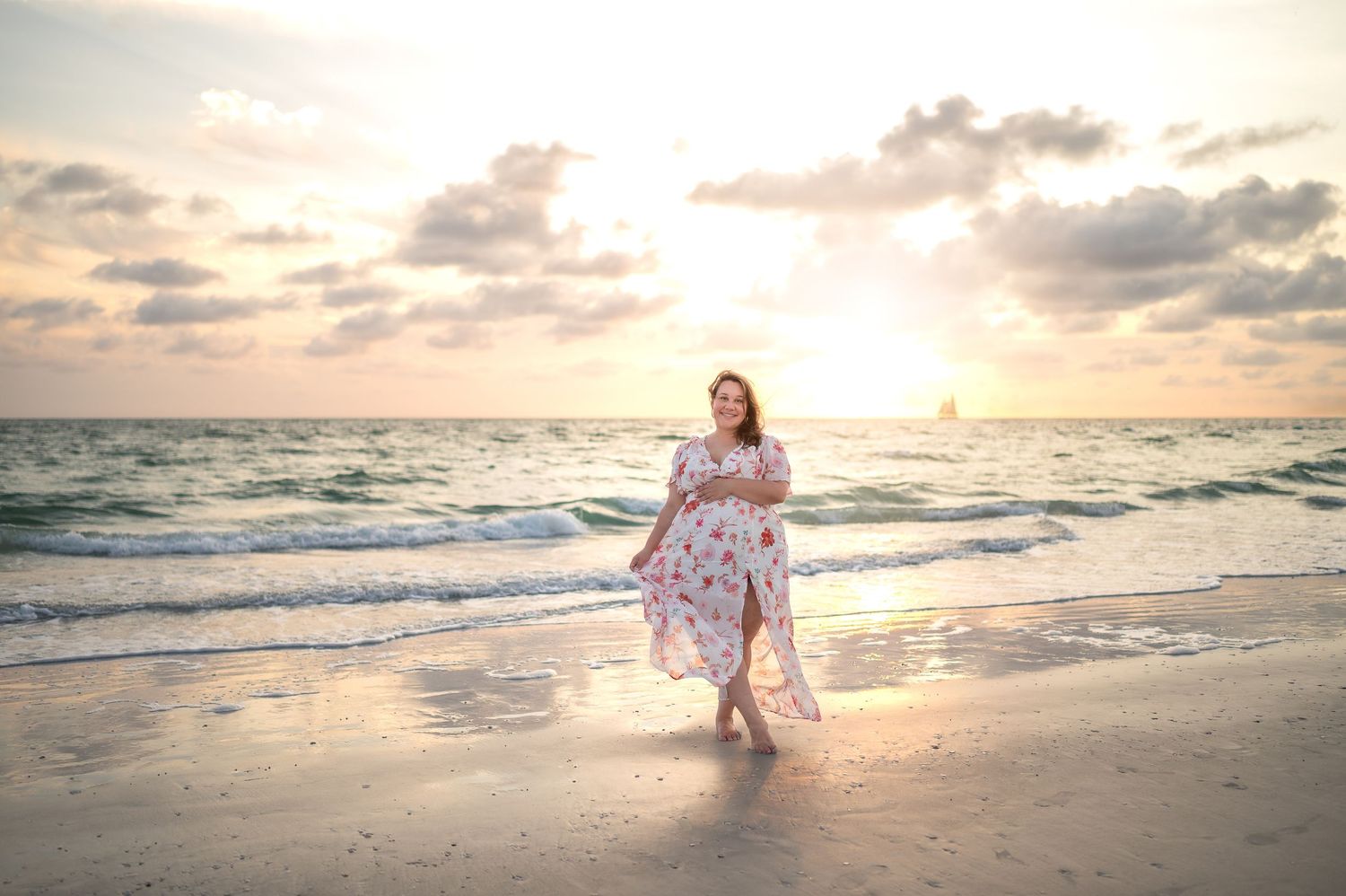 Beautiful beach sunset scene with waves crashing on shore.