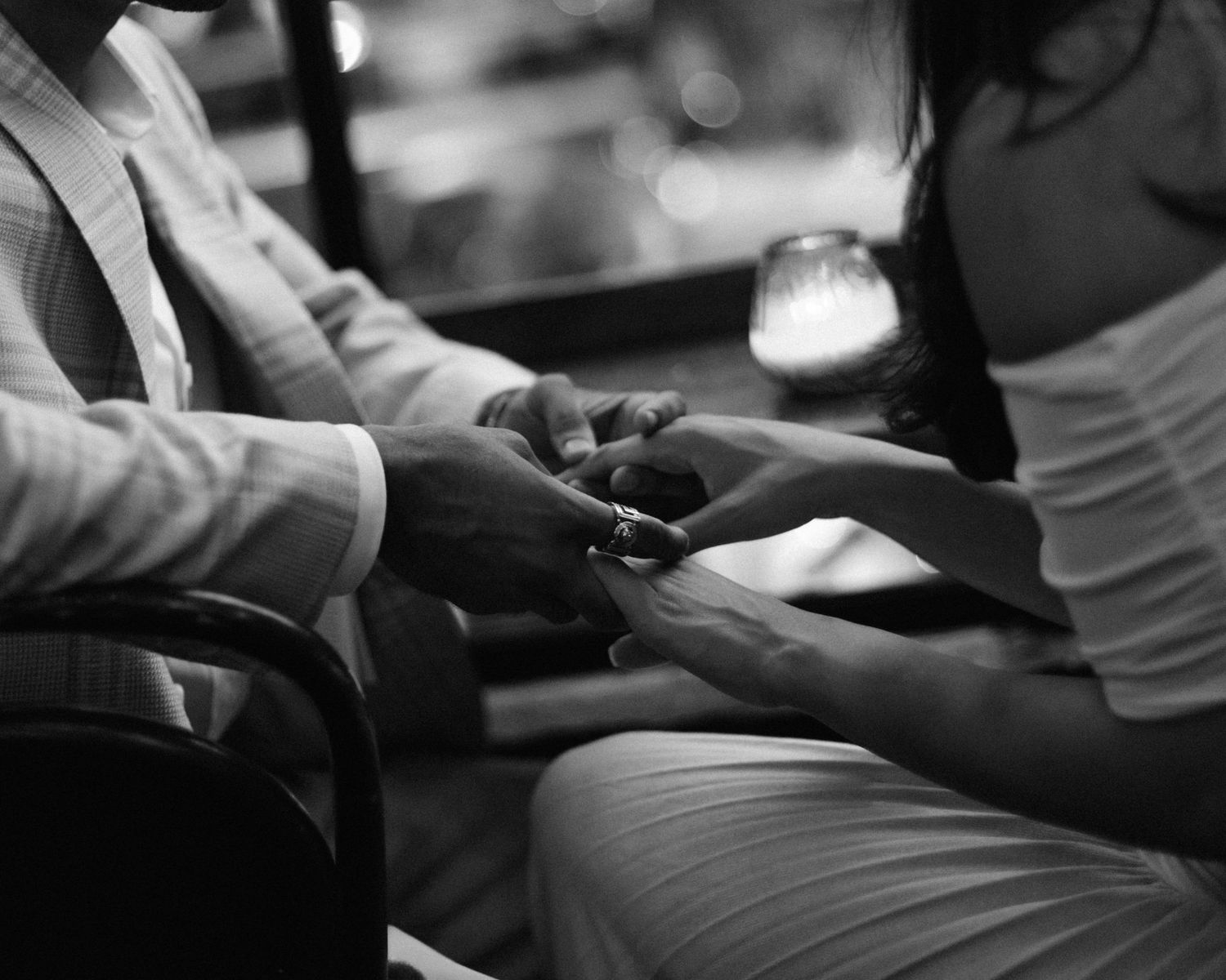 Black and white image of a couple holding hands. Editorial, filmy, cinematic. Sondrvisuals