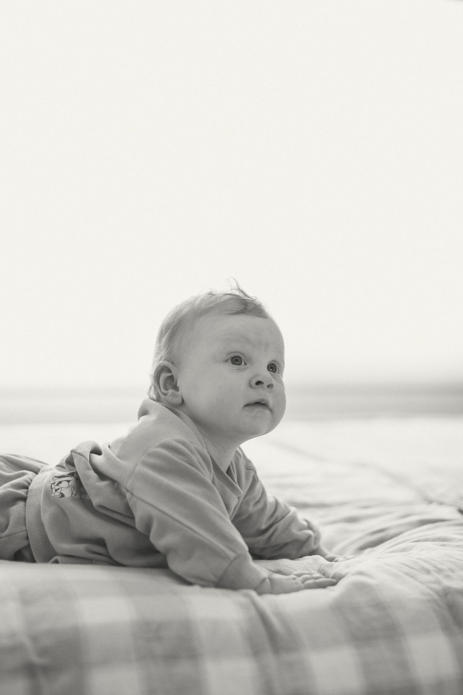 Baby boy looking up while having tummy time | Wollongong and Newcastle family photography.