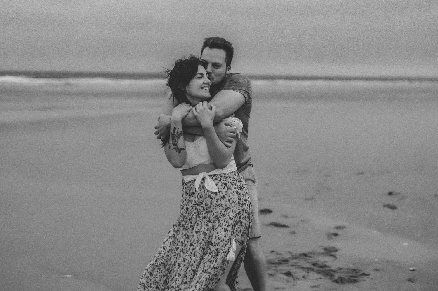 Couple embracing at the beach.