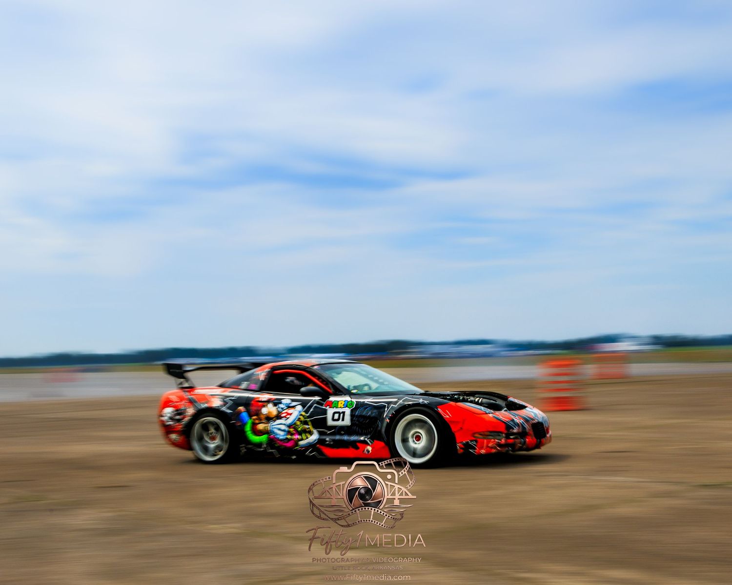 Multi-colored drift car parked on an airport tarmac, Central Arkansas automotive photographer.