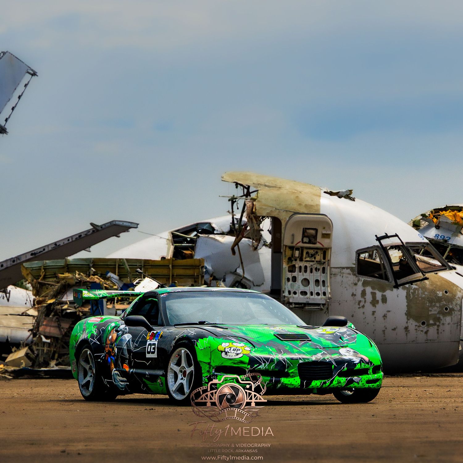 Green drift car drifting with tire smoke in front of an airplane, Arkansas automotive media.