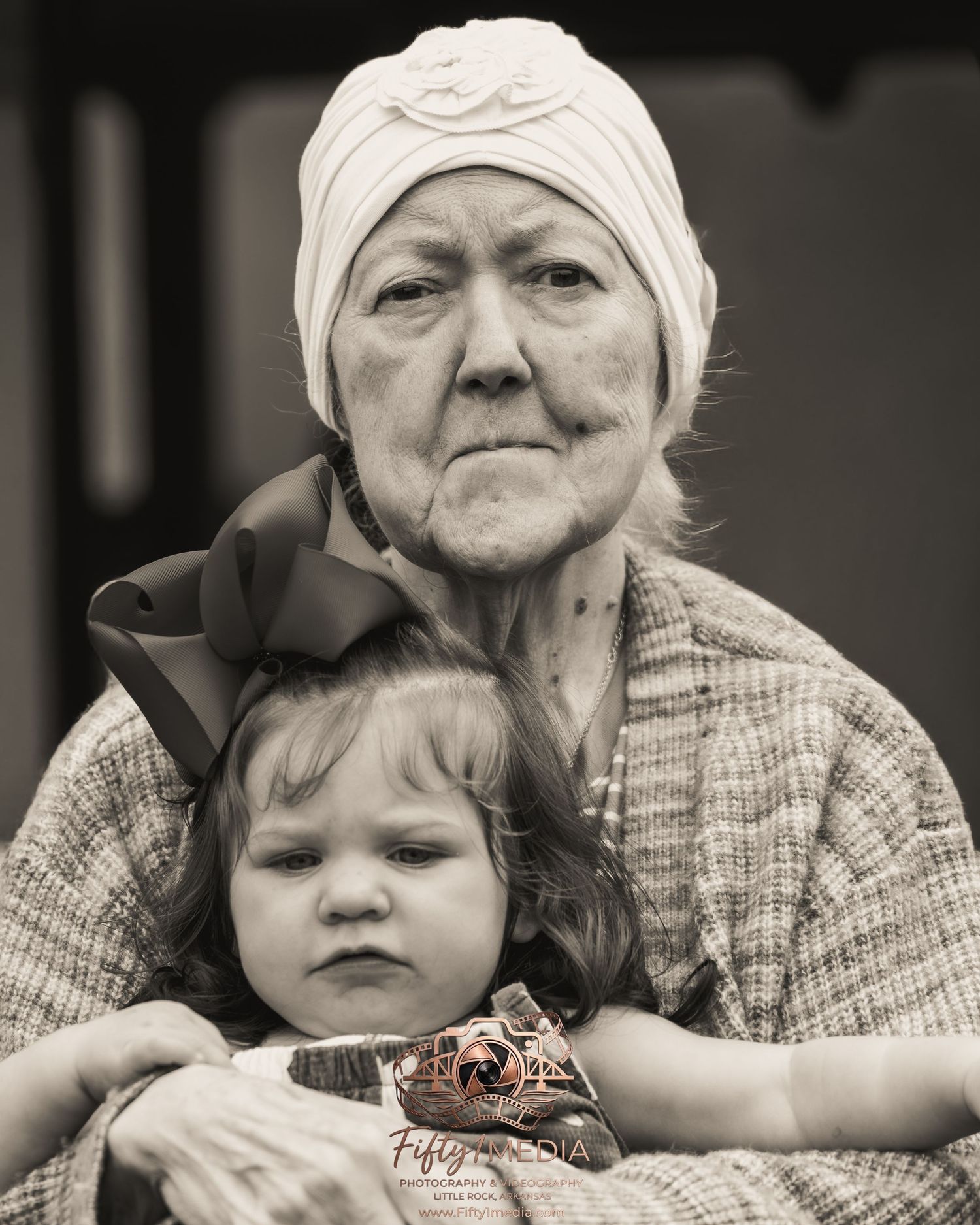 Black and white generational family portrait of a grandmother and young granddaughter in Arkansas.