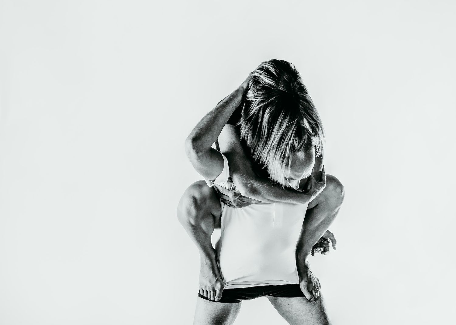 Dramatic black and white portrait of dancer in expressive back pose.