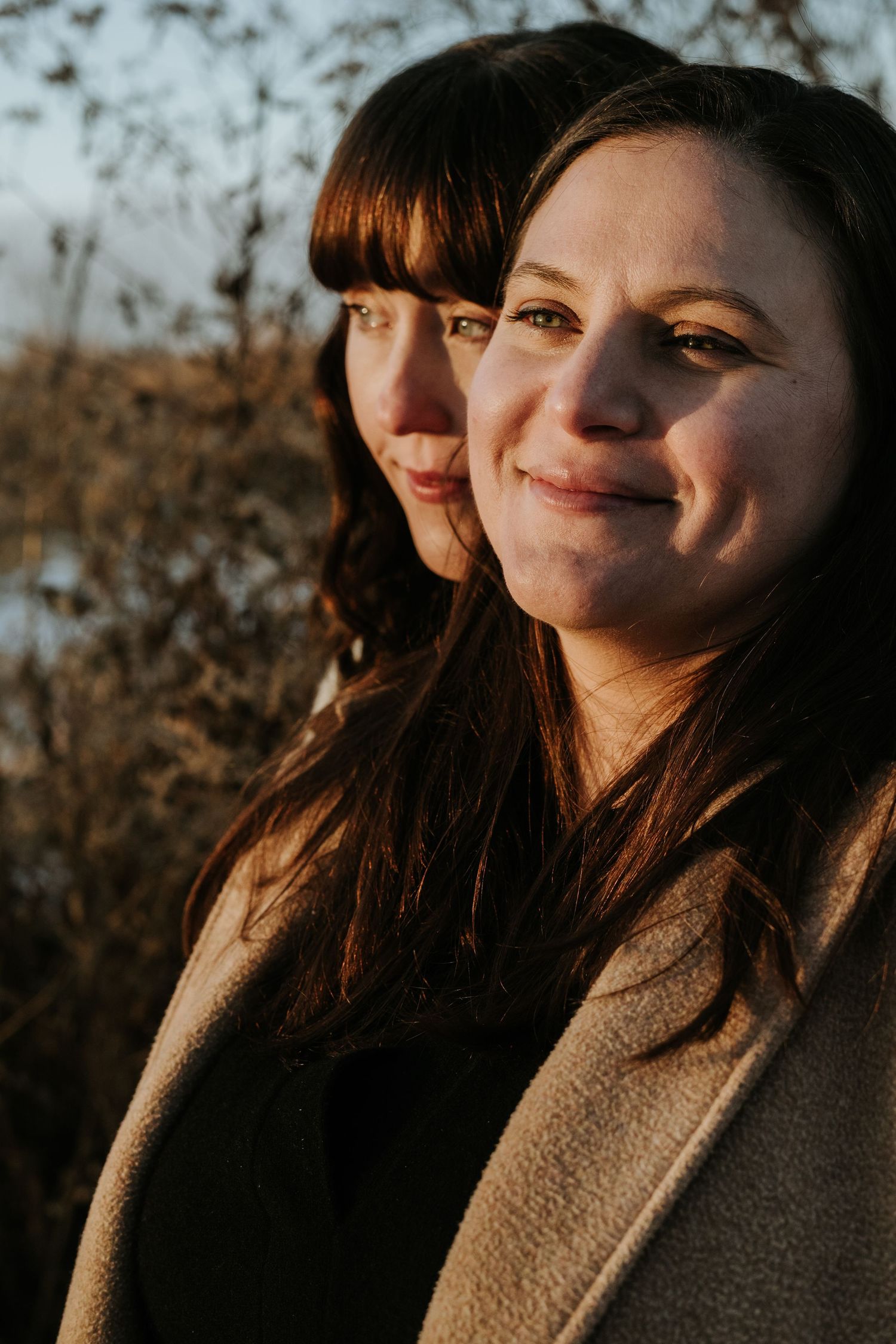 A sequence of five portrait photos showing a person in warm sunlight wearing a brown coat.