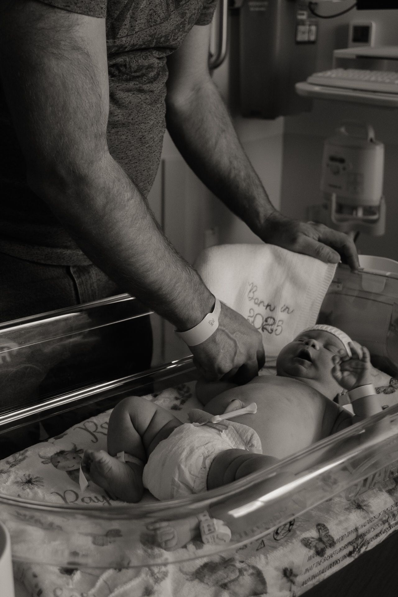 Black and white medical images showing a newborn examination and measurements being taken.