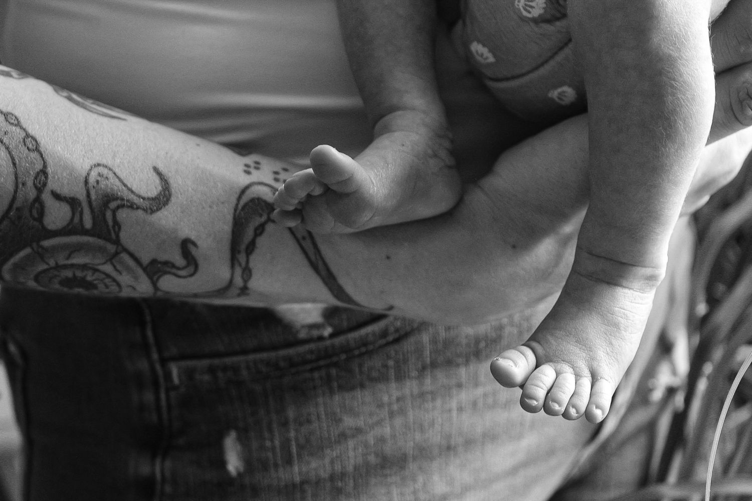 Black and white study of body parts and fabric textures in natural light.
