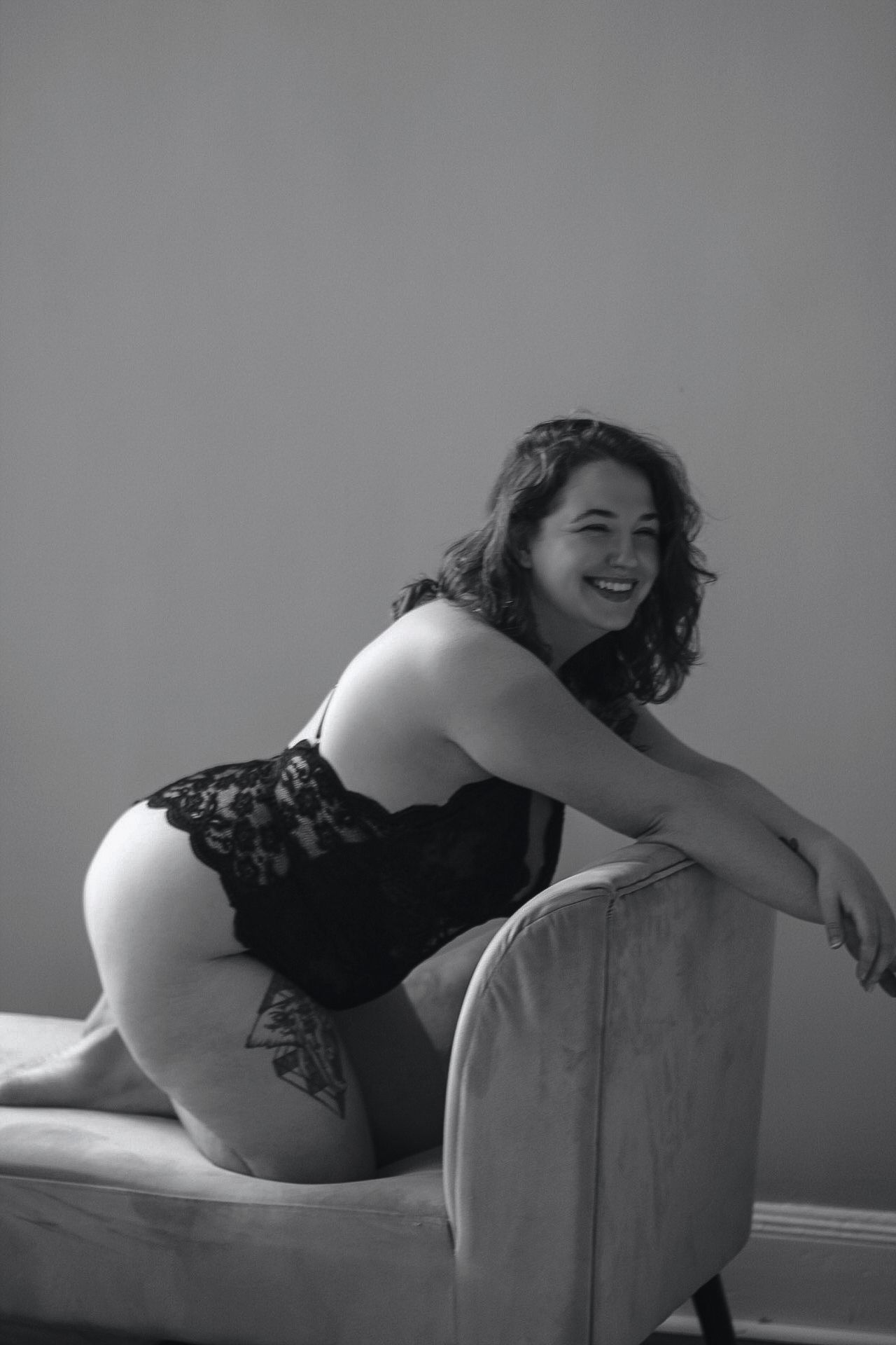 Black and white boudoir portrait showcasing natural poses and lace details.