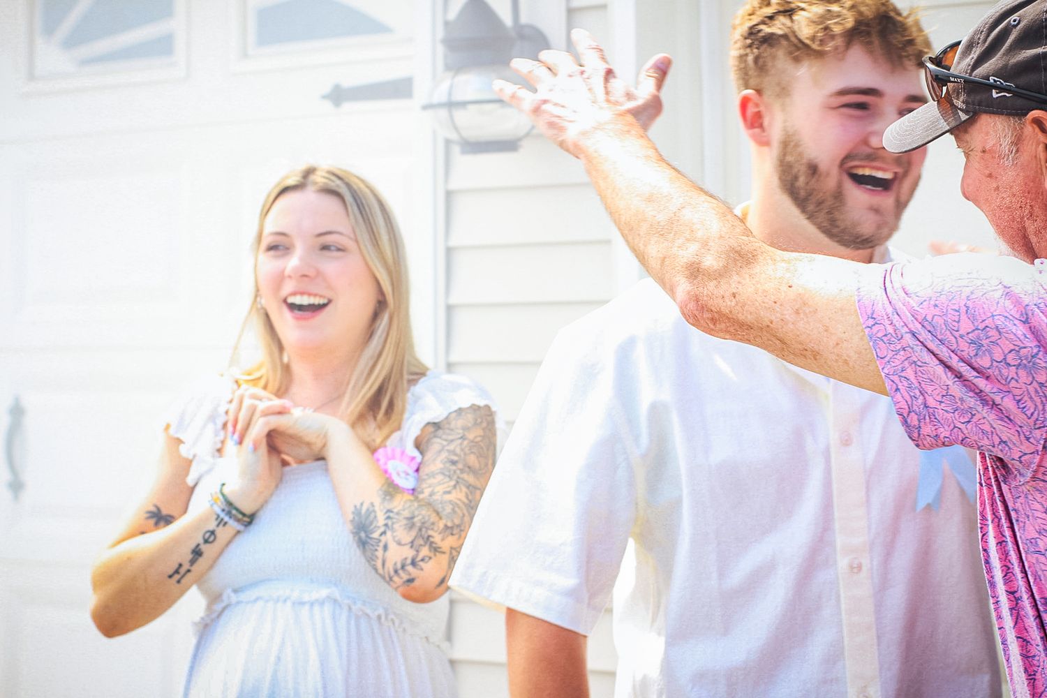 Joyful celebration moment captured with bright natural lighting and warm expressions.