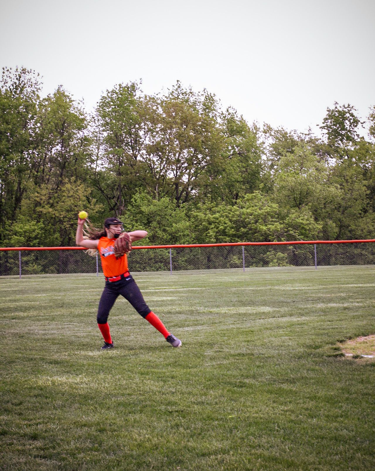 A series of dynamic soccer goalkeeper poses shown in action on a grassy field.
