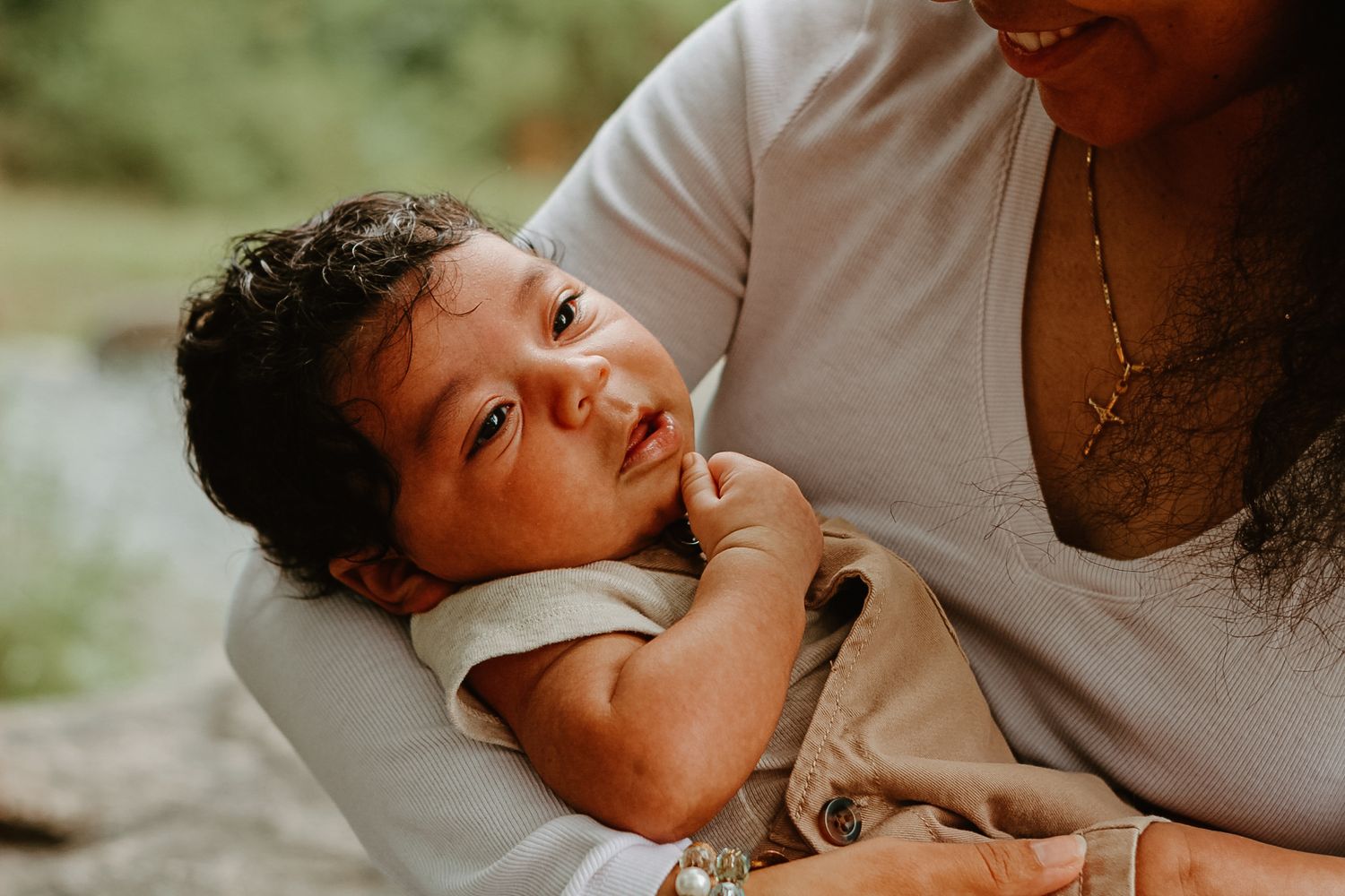 Close up of baby resting peacefully in casual attire.