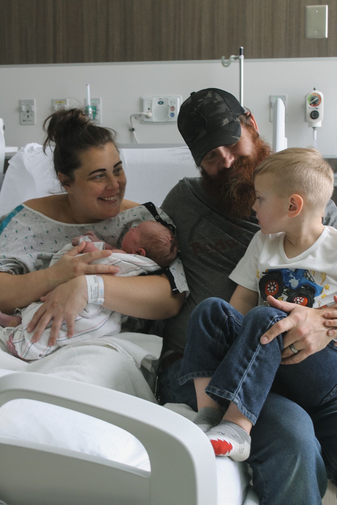 People sharing an intimate moment together on a hospital bed.