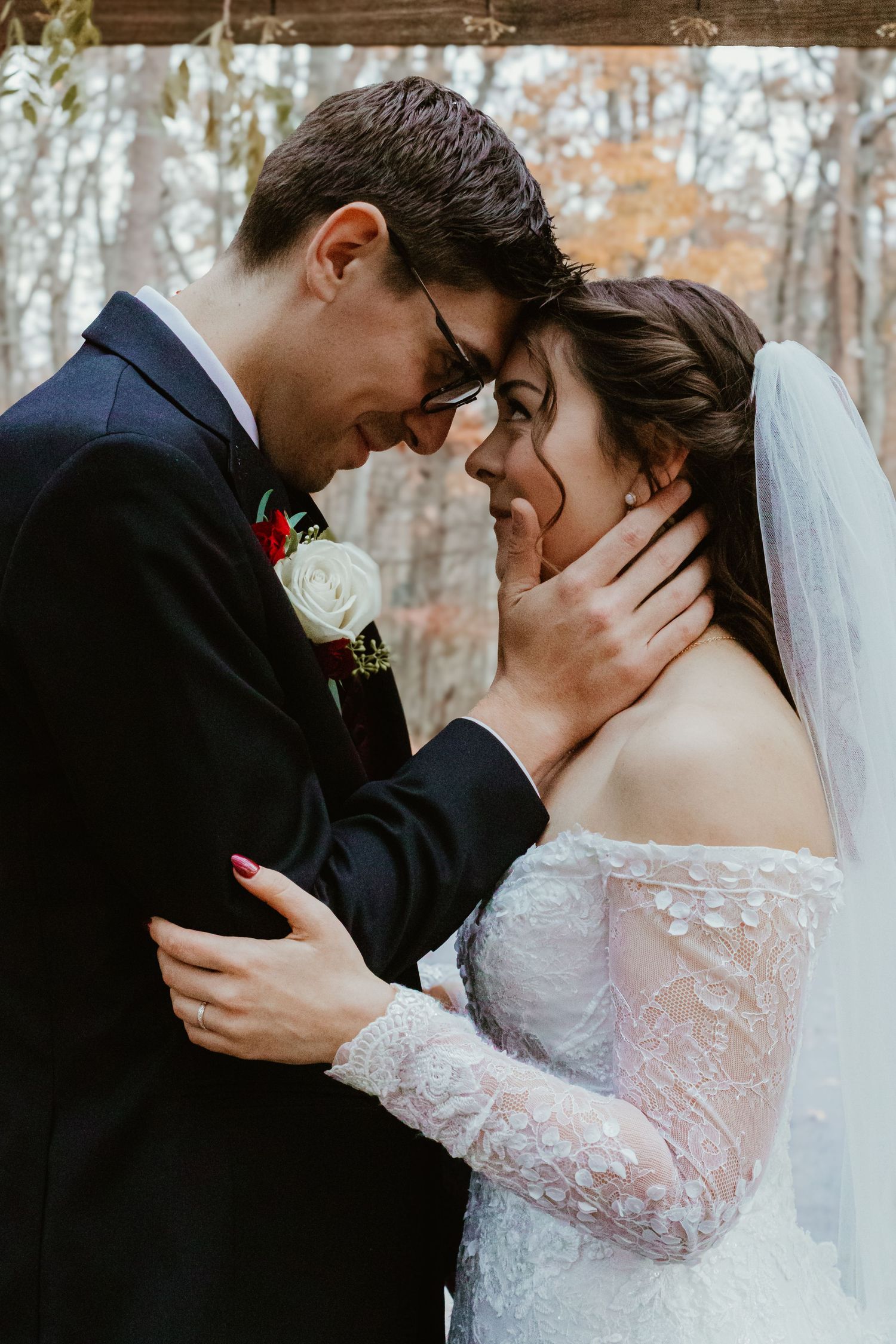 A romantic wedding couple embraces in a series of intimate poses showing tender moments in their white dress and suit.