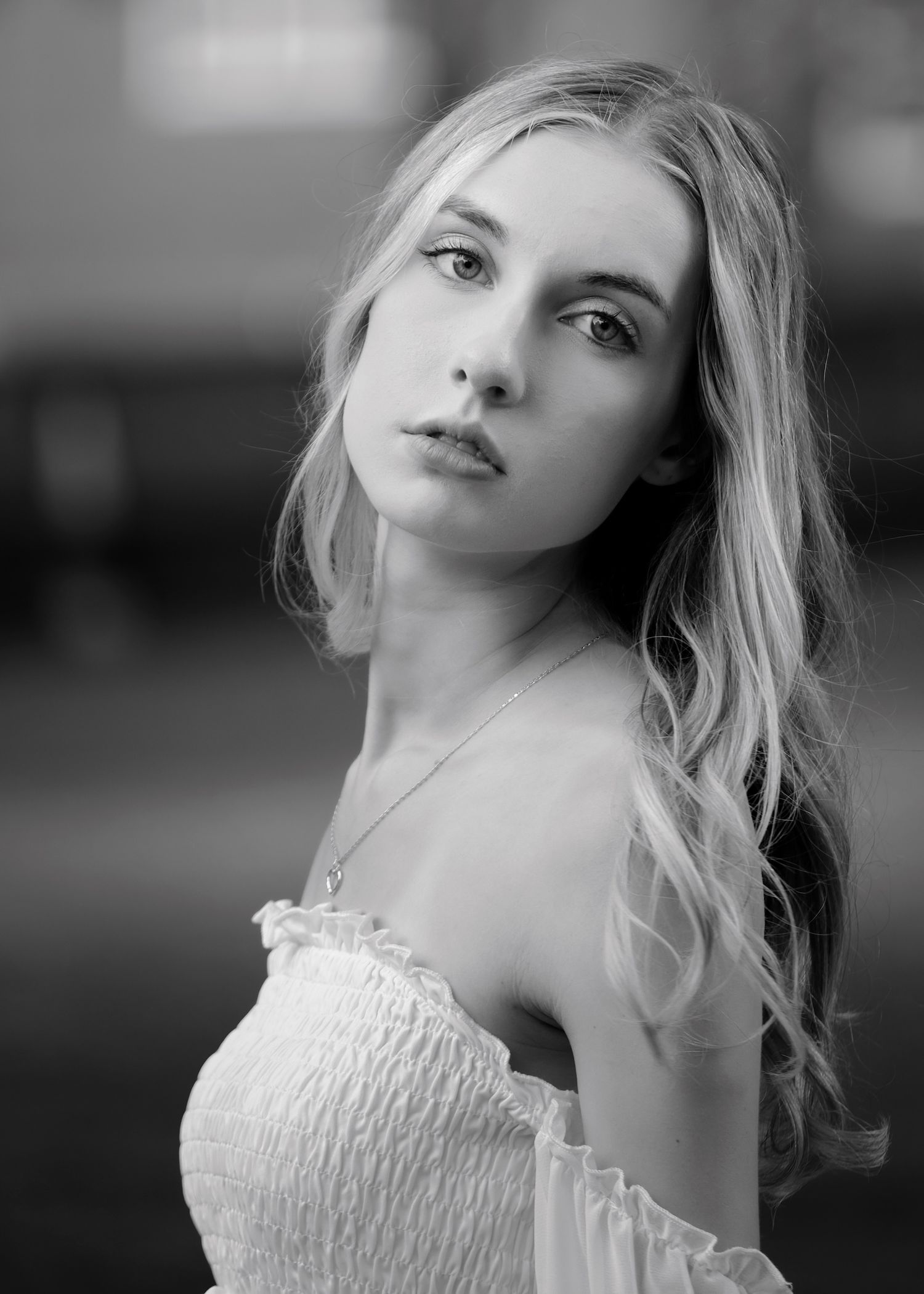 Black and white portrait in soft focus with delicate lace details.
