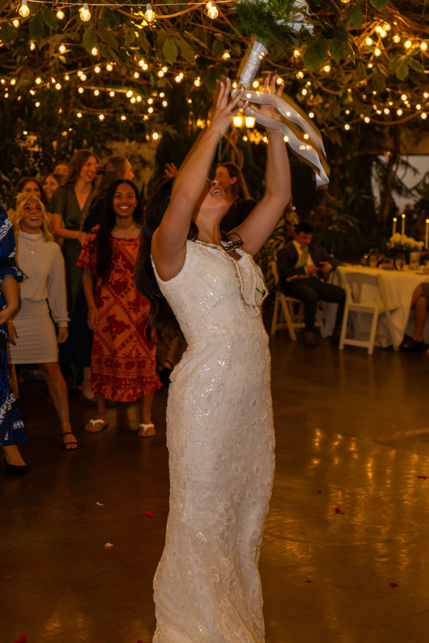 bride throwing bridal bouquet