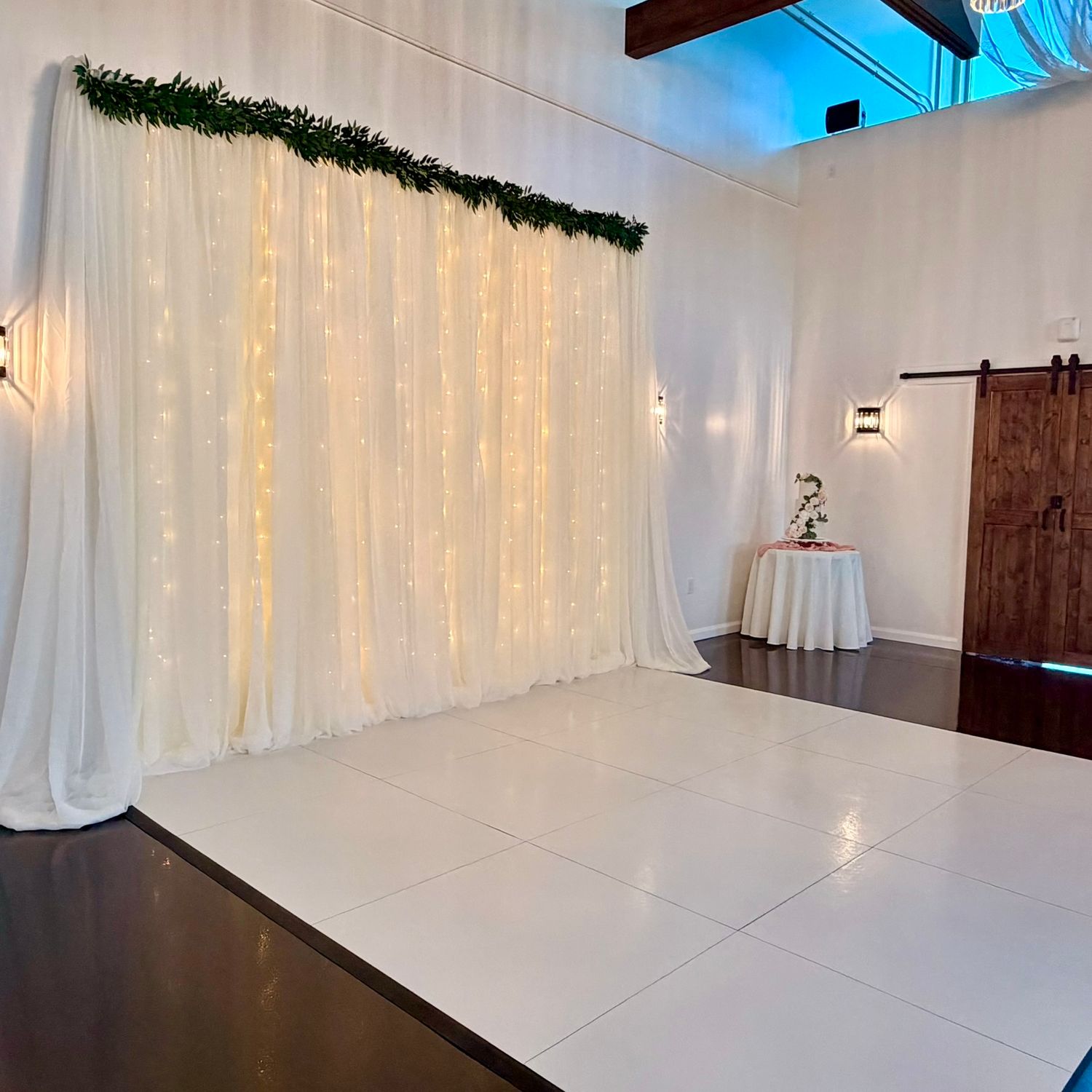 image of the event hall at The Southern Chateau Wedding Venue in Payson, Utah County, Utah, and its customizable dance floor and backdrop