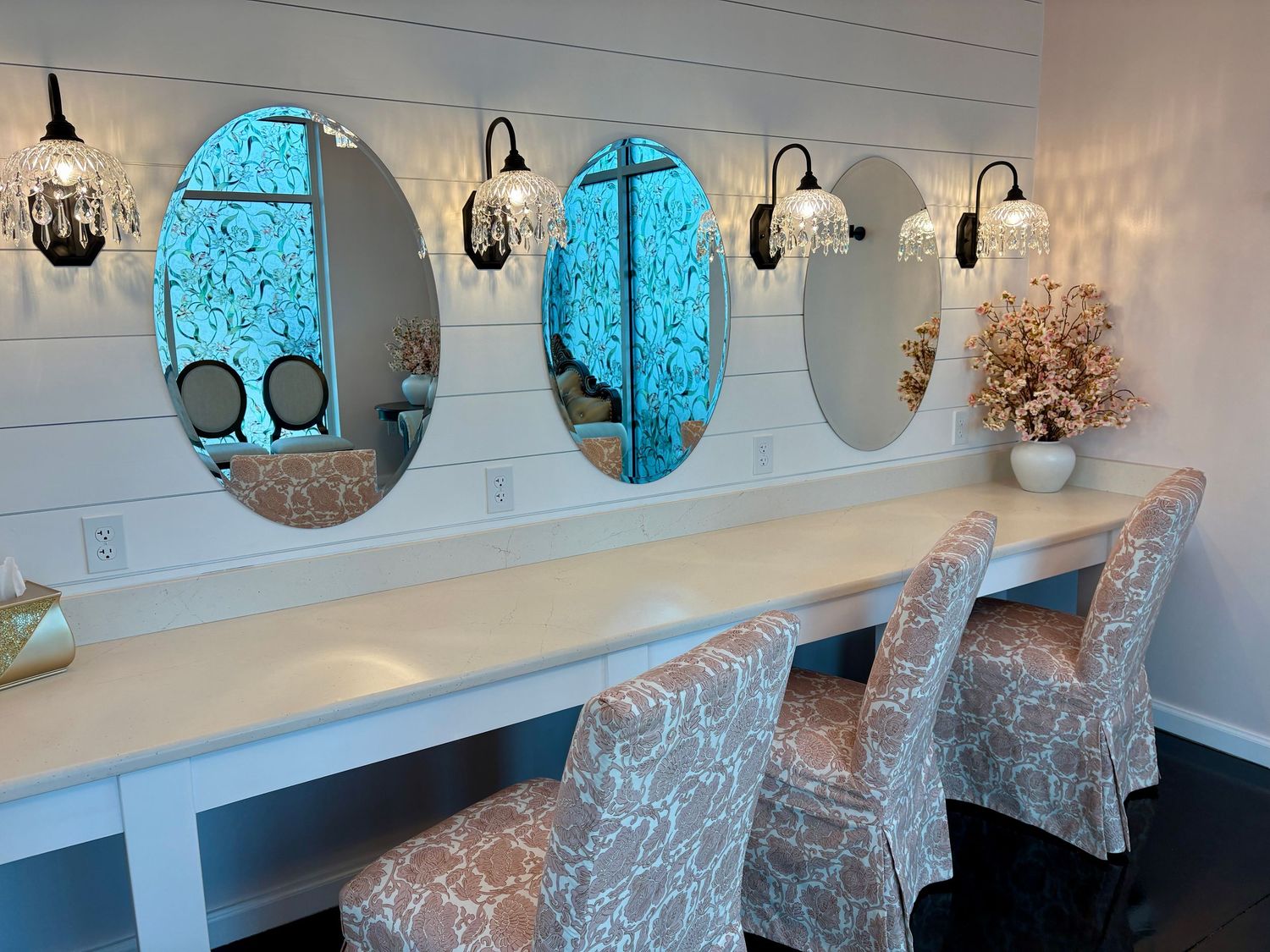 image of the southern chateau wedding venue bridal suite vanity from a side angle, with chairs pulled out slightly