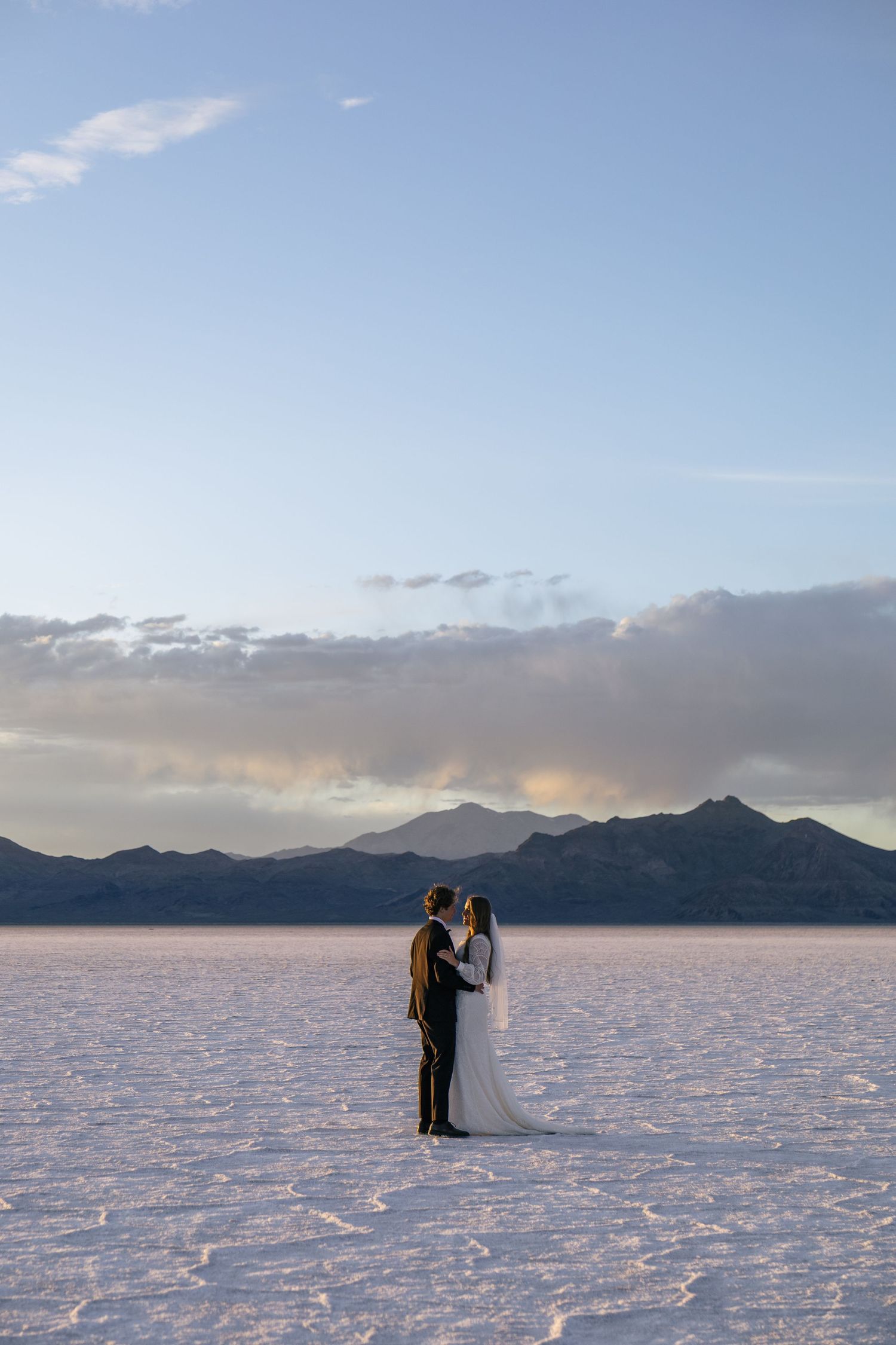 couple dancing on the Utah salt flats at sunset