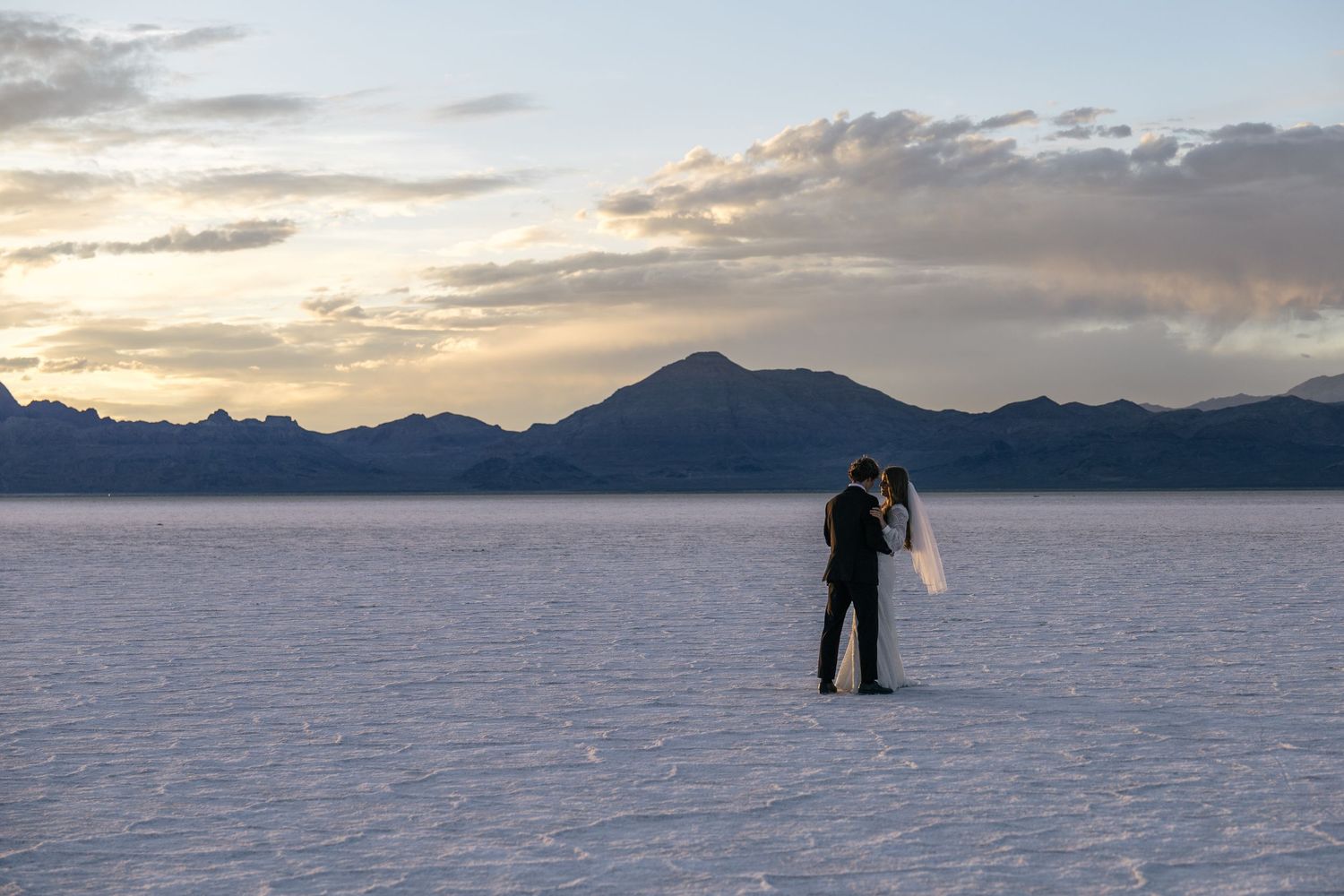 first look photo on the Utah salt flats at sunset by Utah Wedding Photographer Sarah Rogers Photography