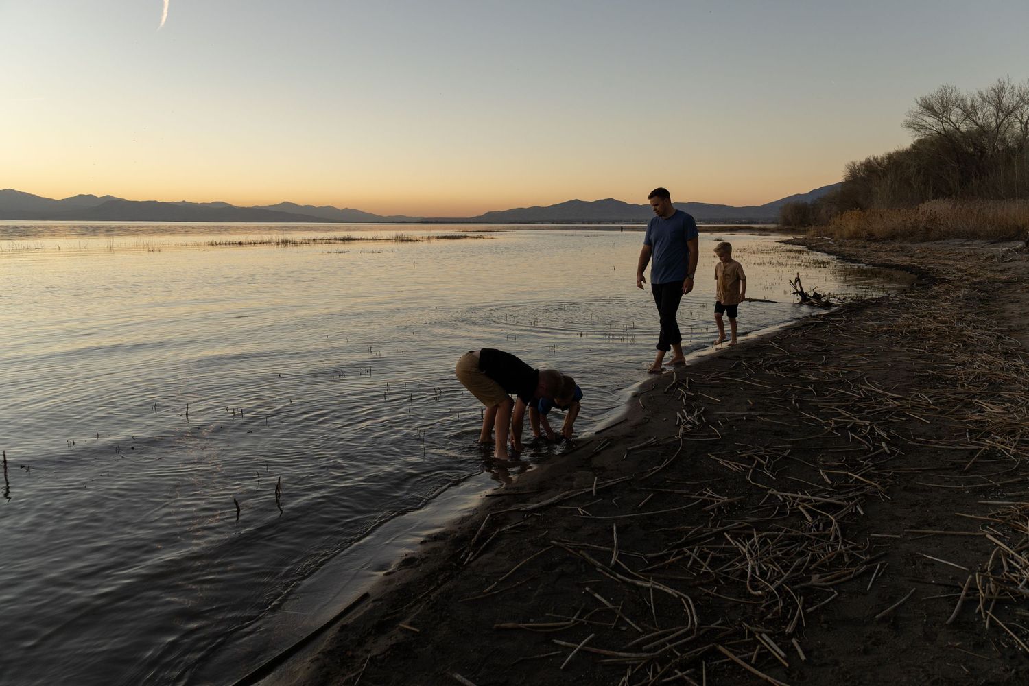 family photos at utah lake at sunset, kids playing in the water