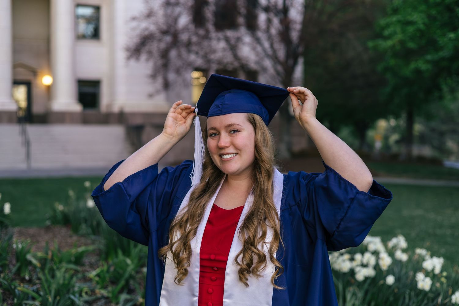 byu graduate in front of garden and building