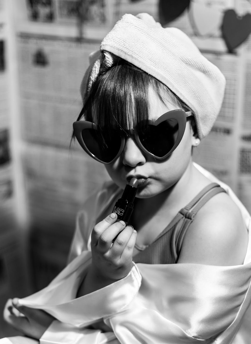 A girl in sunglasses and hair towel strikes dramatic poses in a black and white photo collage. Cincinnati/ northern Kentucky