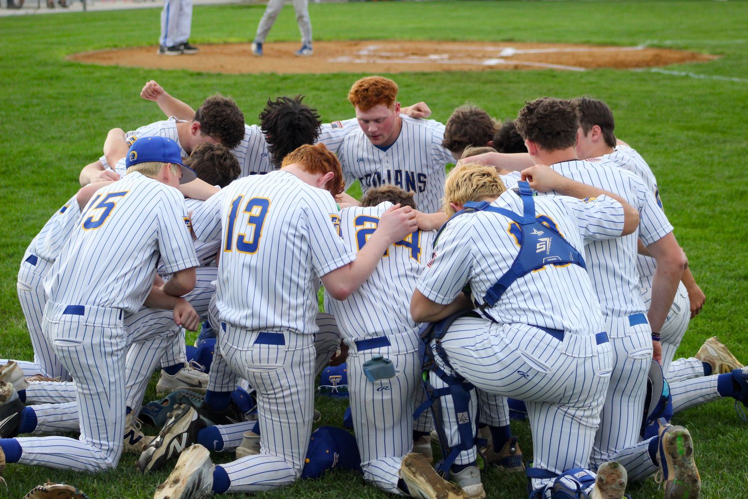 Triton H.S. (Bourbon) Varsity Baseball Team huddling before a tense home game.