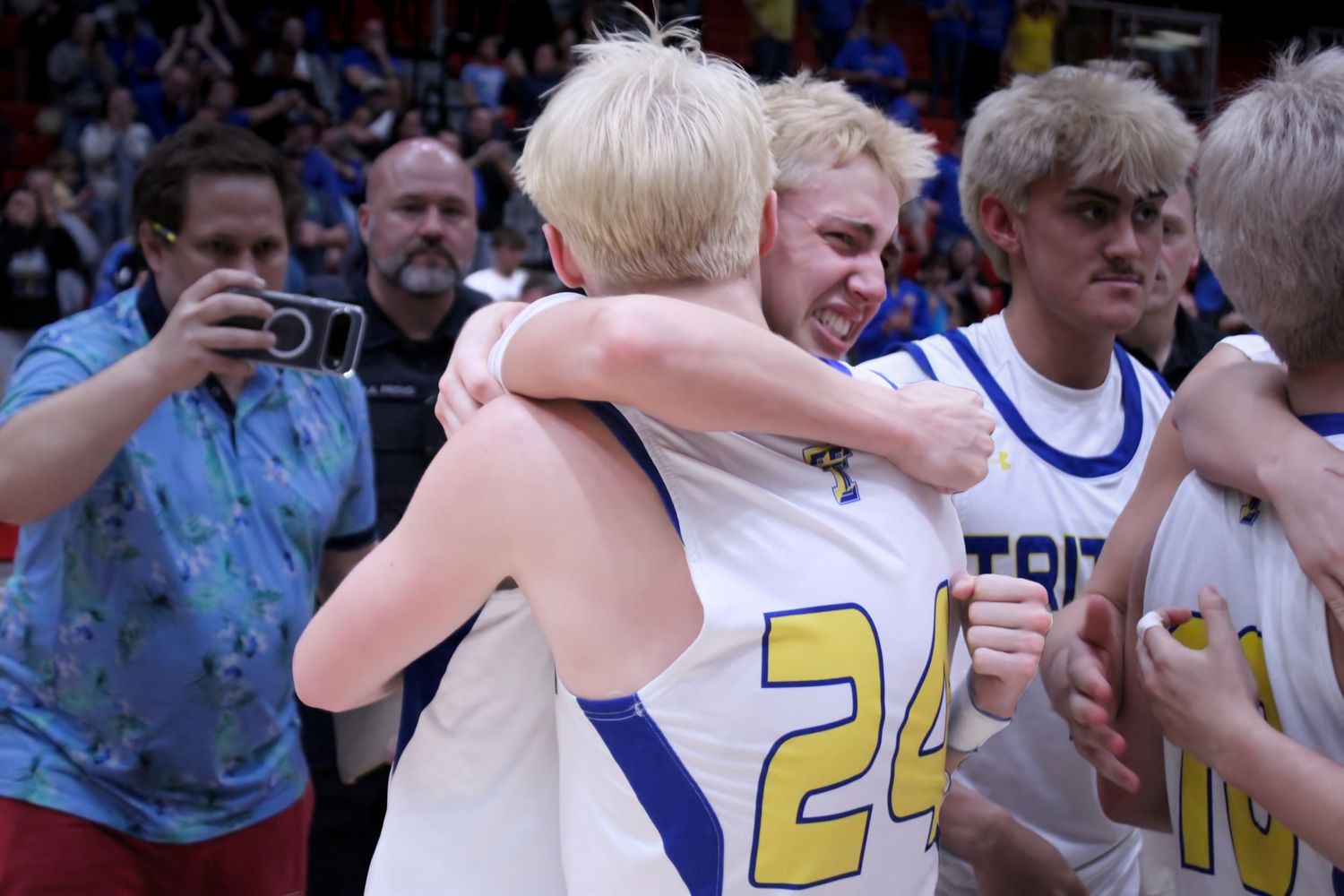 Triton H.S. (Bourbon) Varsity Basketball Player Landon Patrick hugging Brayden Wood after a Semi-State championship win.
