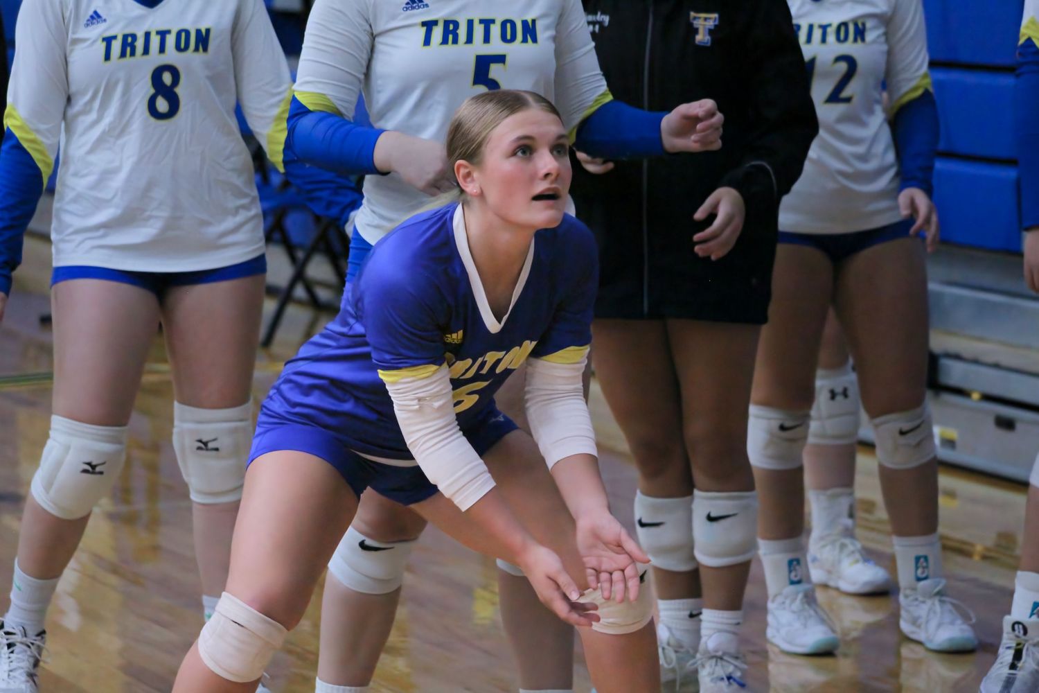 Triton H.S. (Bourbon) Varsity Volleyball Player Lydia Hammond practicing with her teammates before a home game.