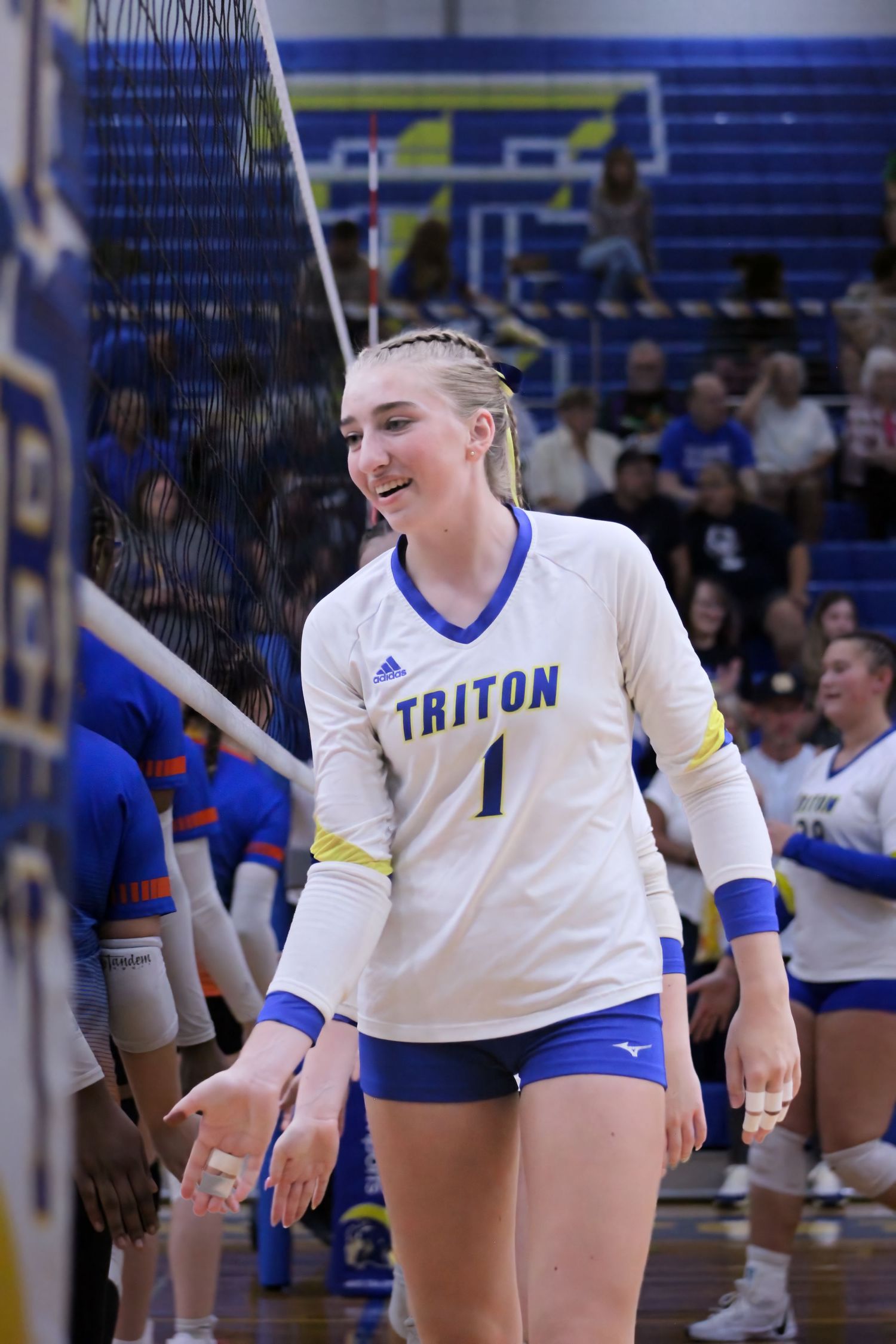 Triton H.S. (Bourbon) Varsity Volleyball Player Savannah Hawley shaking hands with the opponent after a home win.