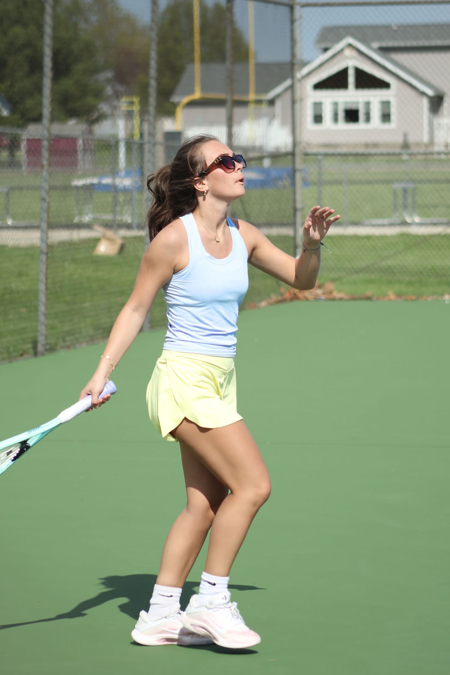 Triton H.S. (Bourbon) Varsity Tennis Player Janika Kemp participating in a home tennis match.