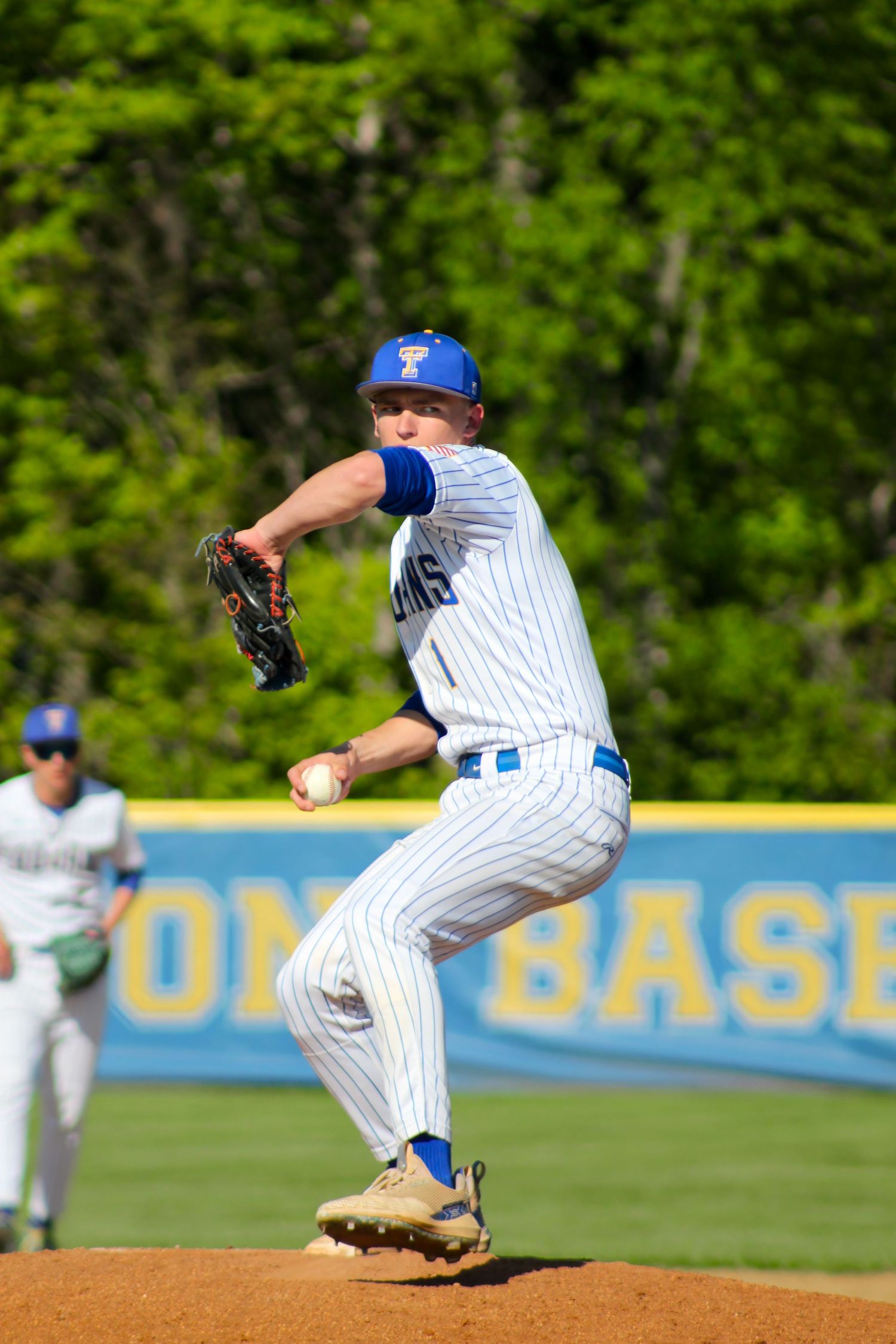 Triton H.S. (Bourbon) Varsity Baseball Player Drew Bingamon pitching during a home game.