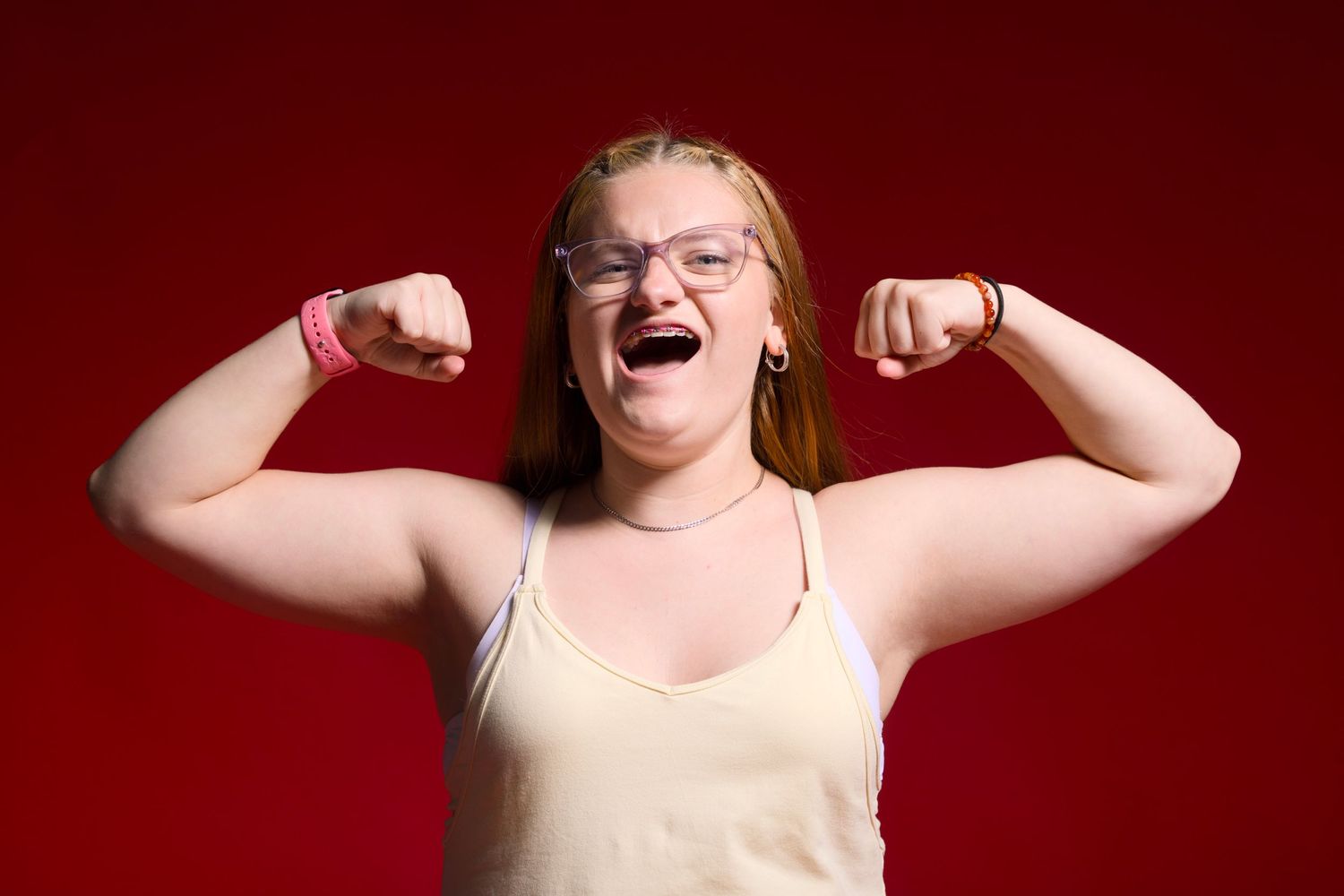 Indiana University HSJI's Kam Stokes flexing for a mock studio/media day photograph.