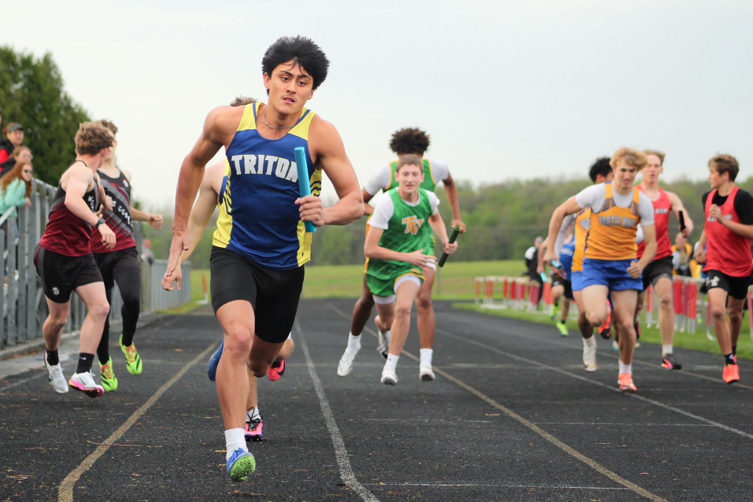 Triton H.S. (Bourbon) Varsity Track Sprinter Isaac Quintana participating in the 4x100m at the 2026 Warrior Relays.