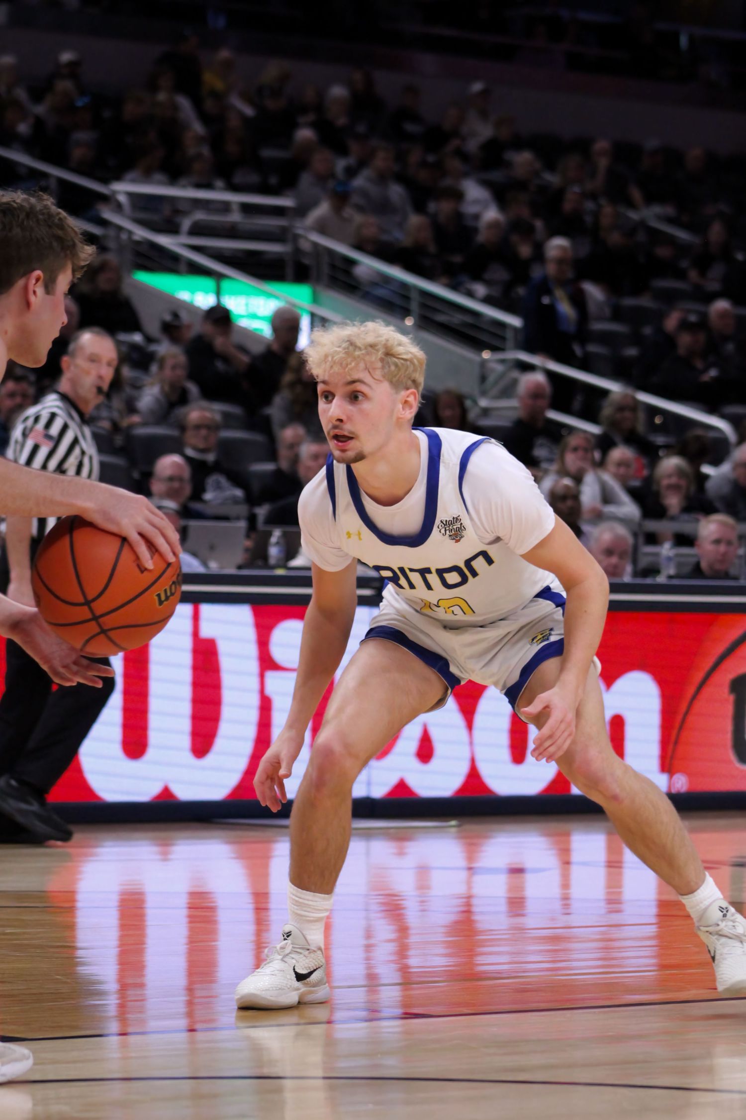 Triton H.S. (Bourbon) Varsity Basketball Player Gage Riffle defending during the IHSAA 1A State Championship game in Gainbridge Fieldhouse.