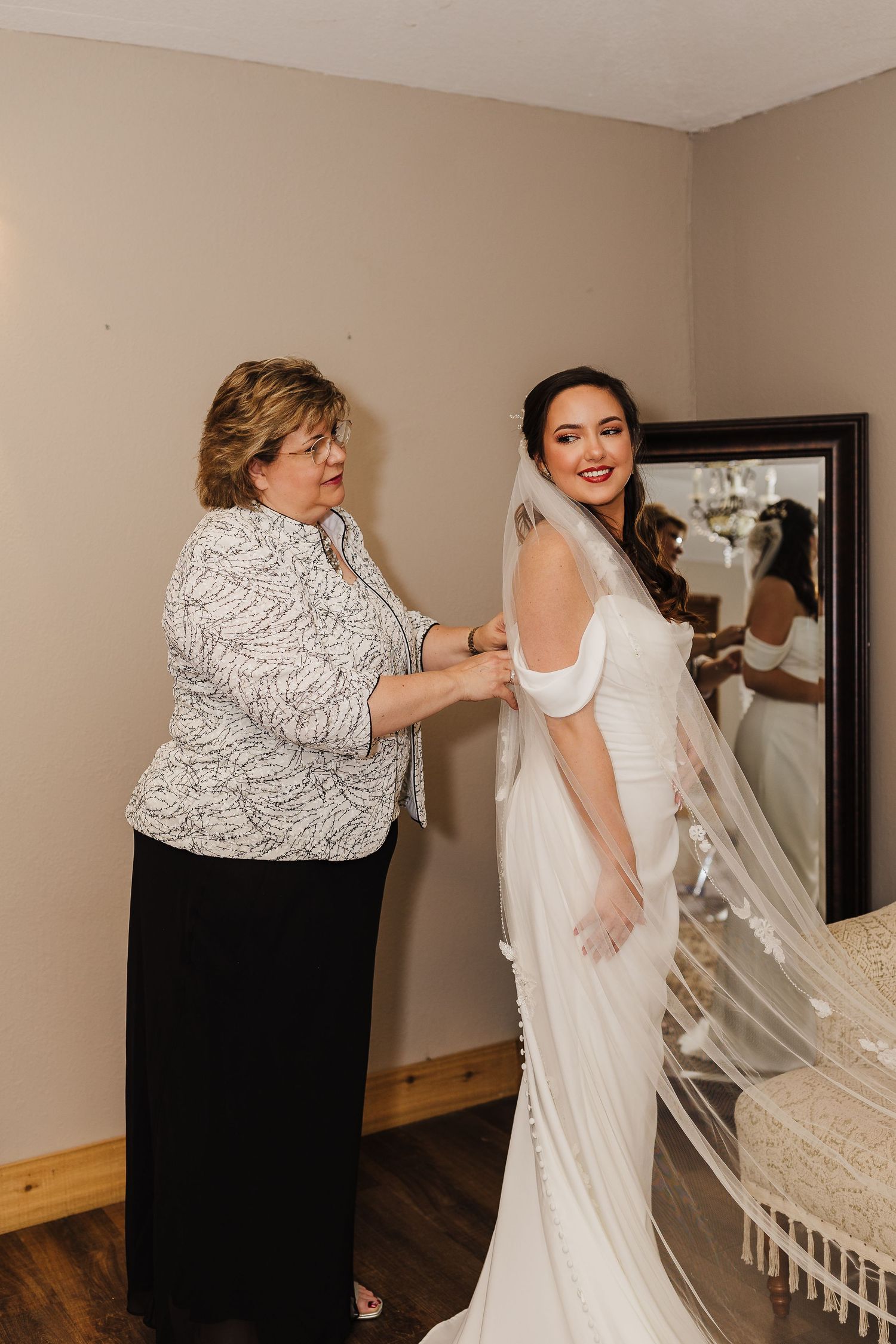 A series of getting ready photos showing someone being helped into an elegant white wedding dress.