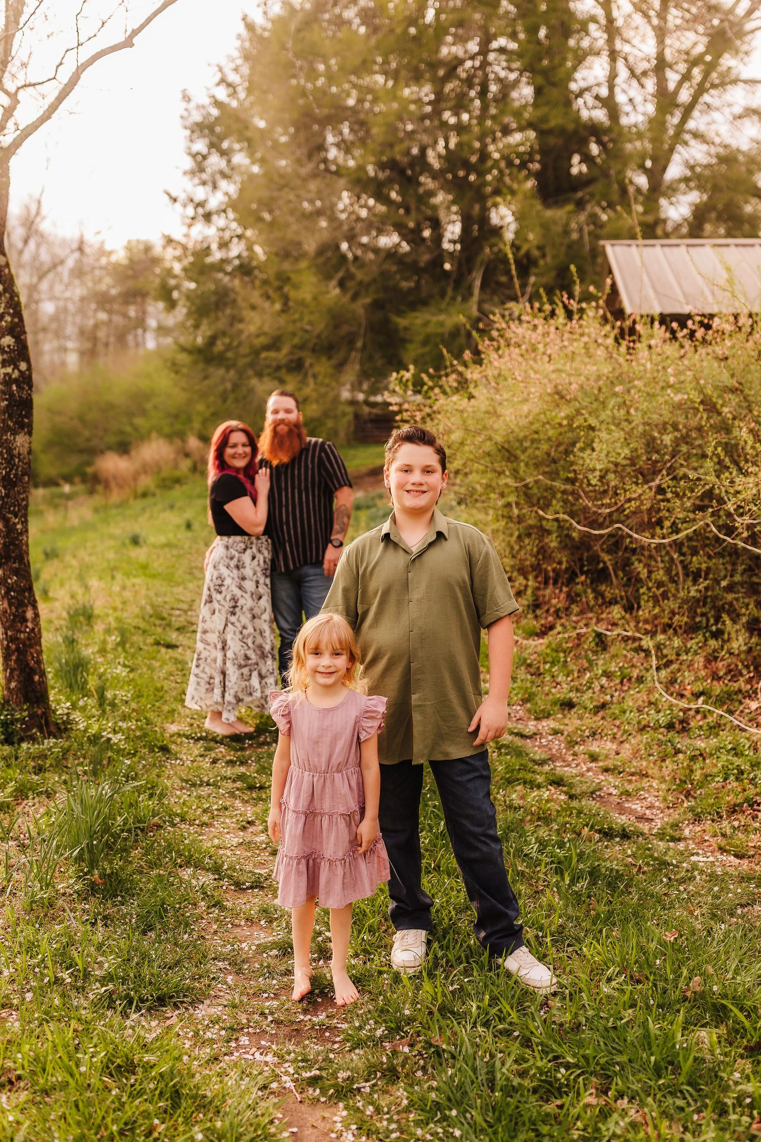 Heartwarming family portrait in Dahlonega with children as the focus and parents watching proudly