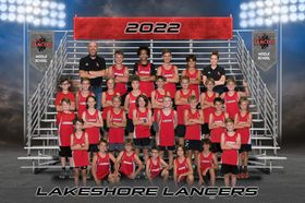 Lakeshore Lancers 2022 middle school cross country team poses on bleachers in red uniforms.