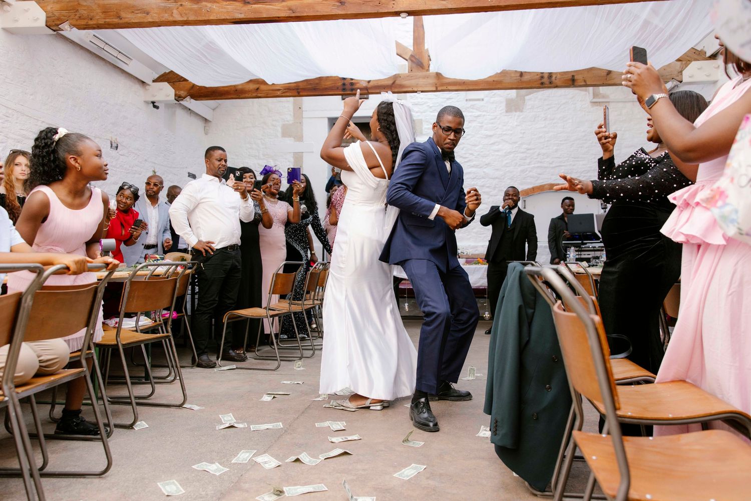 Silkmill studio, Frome bride and groom dancing at their part with dolls bills flying